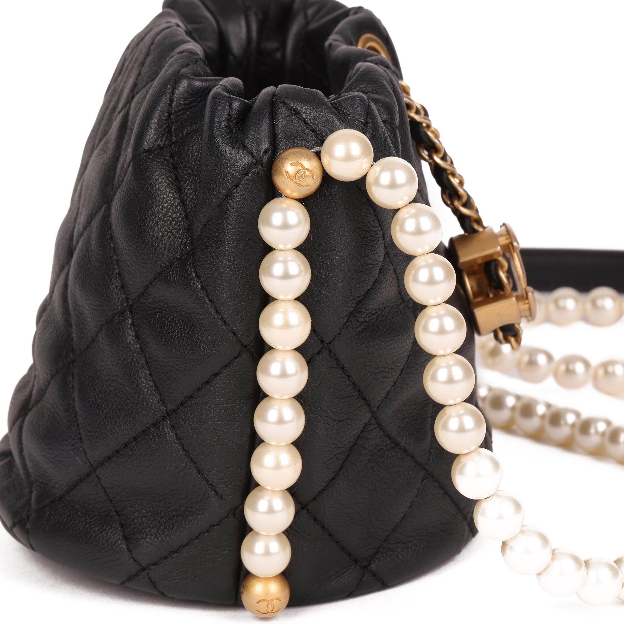 CHANEL
Black Quilted Calfskin Leather Pearl Micro Bucket Bag

Xupes Reference: HB4149
Serial Number: 31189067
Age (Circa): 2021
Accompanied By: Chanel Dust Bag, Authenticity Card
Authenticity Details: Authenticity Card, Serial Sticker (Made in