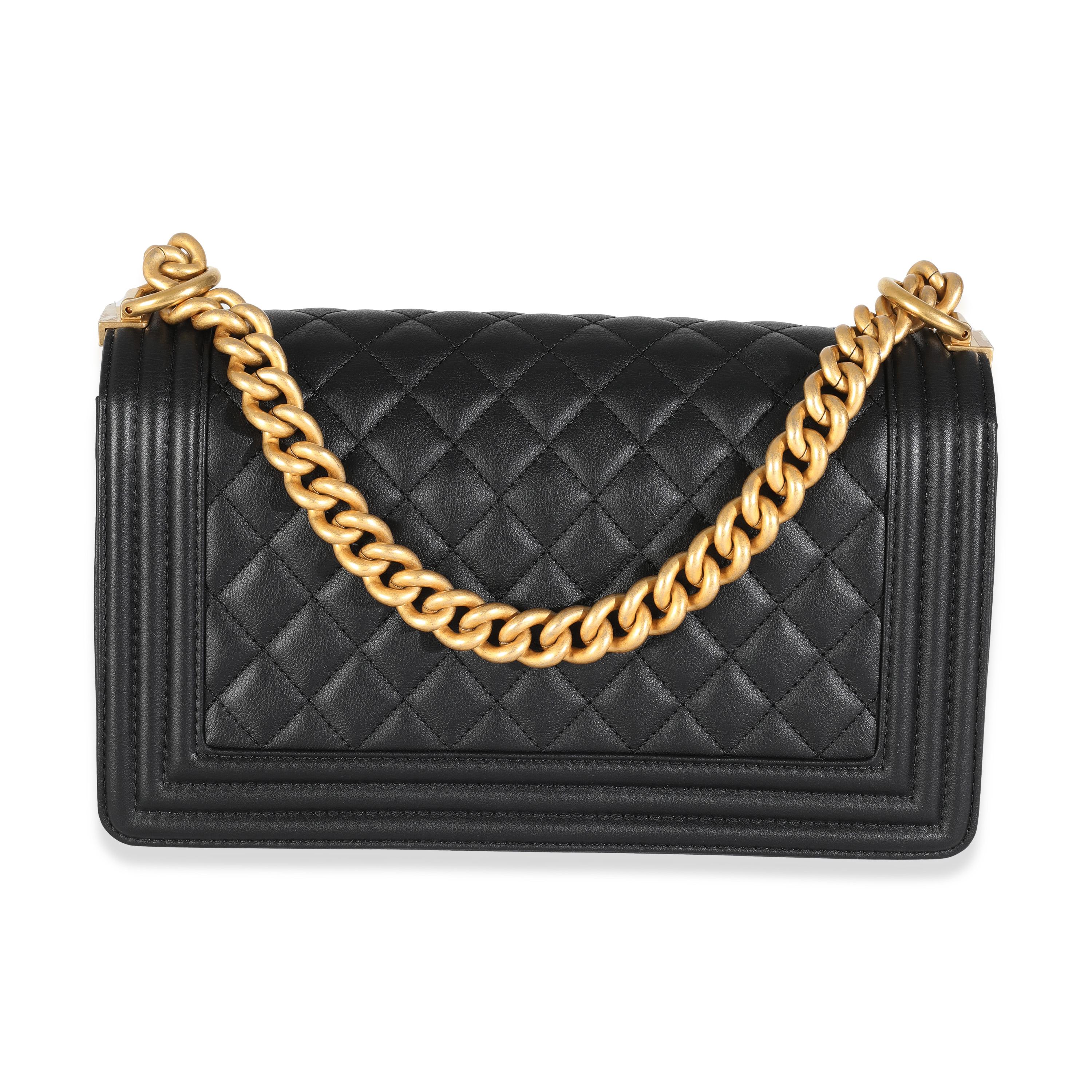 Listing Title: Chanel Black Quilted Calfskin Medium Boy Bag
SKU: 144479
MSRP: 6900.00 USD
Condition: Pre-owned 
Condition Description: An instant classic, the Boy bag from Chanel was introduced in 2011. The quilted bag was designed by the late Karl