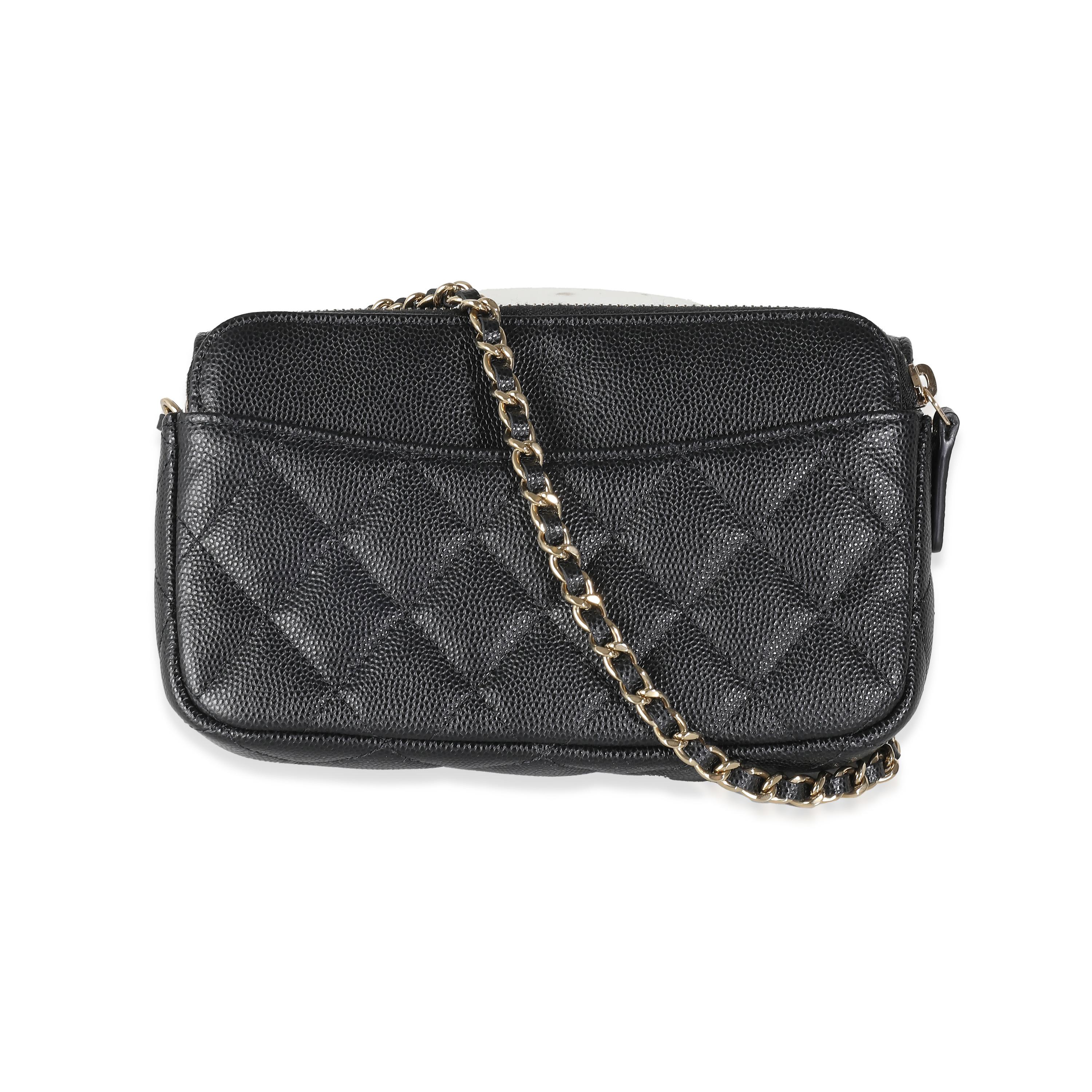 Listing Title: Chanel Black Quilted Caviar Flap Phone Holder With Chain
SKU: 140389
Condition: Pre-owned 
Condition Description: A timeless classic that never goes out of style, the flap bag from Chanel dates back to 1955 and has seen a number of