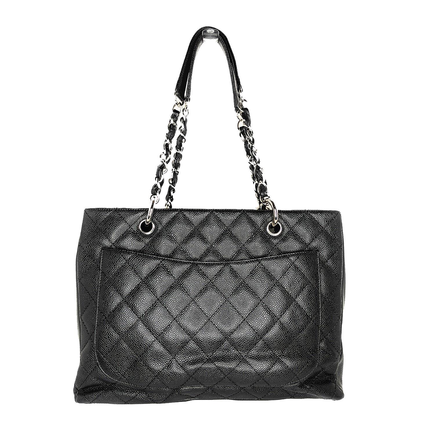 This stylish tote is crafted of diamond-quilted caviar leather in black. This shoulder bag features leather-threaded polished silver chain-link shoulder straps with shoulder pads, a quilted Chanel CC logo on the front, and a flat pocket on the rear.