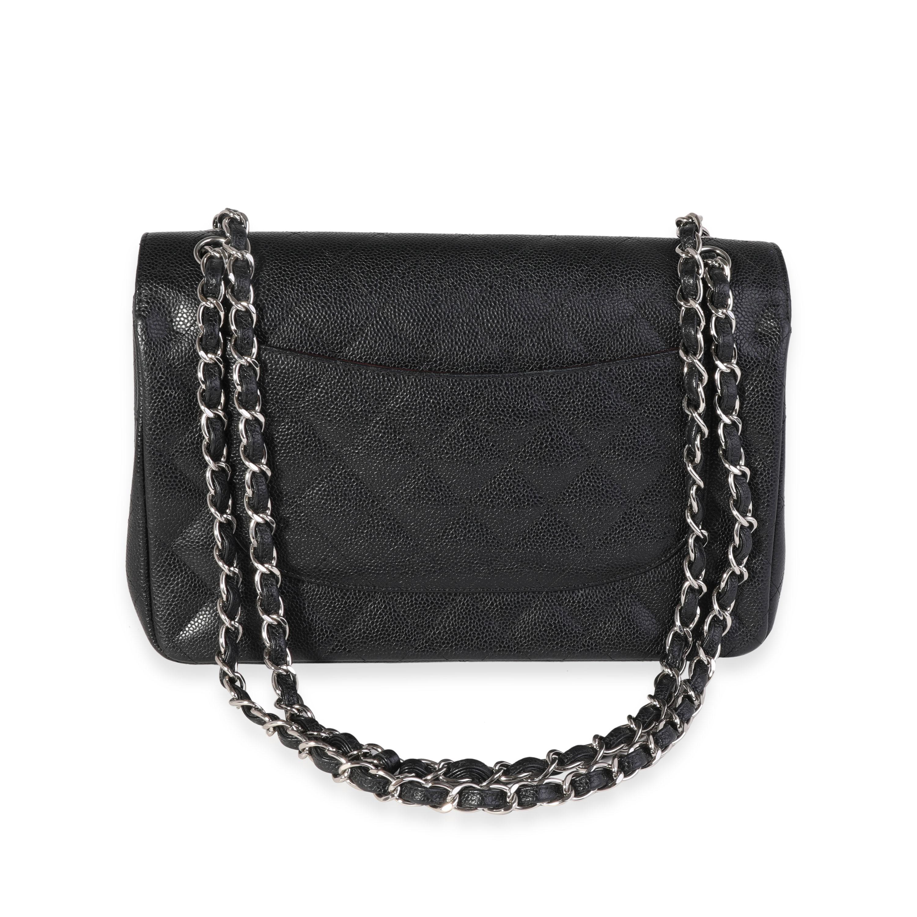 Listing Title: Chanel Black Quilted Caviar Jumbo Classic Double Flap Bag
SKU: 121585
MSRP: 9500.00
Condition: Pre-owned 
Handbag Condition: Very Good
Condition Comments: Very Good Condition. Scuffing at corners. Minor scratching at hardware.