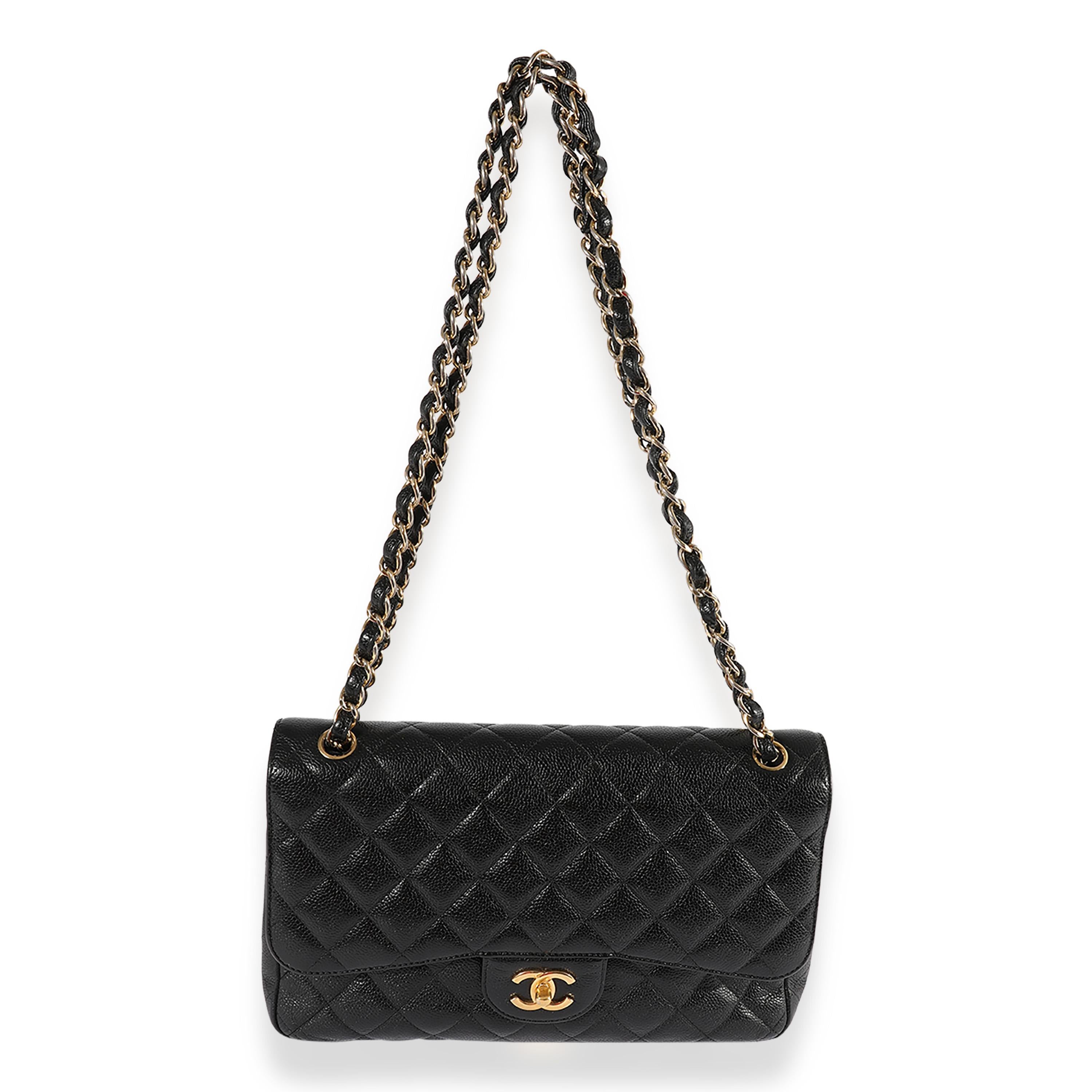Listing Title: Chanel Black Quilted Caviar Jumbo Classic Double Flap Bag
SKU: 120154
MSRP: 9500.00
Condition: Pre-owned 
Handbag Condition: Very Good
Condition Comments: Wear to corners. Tarnishing to chain. Scratches on hardware. Interior
