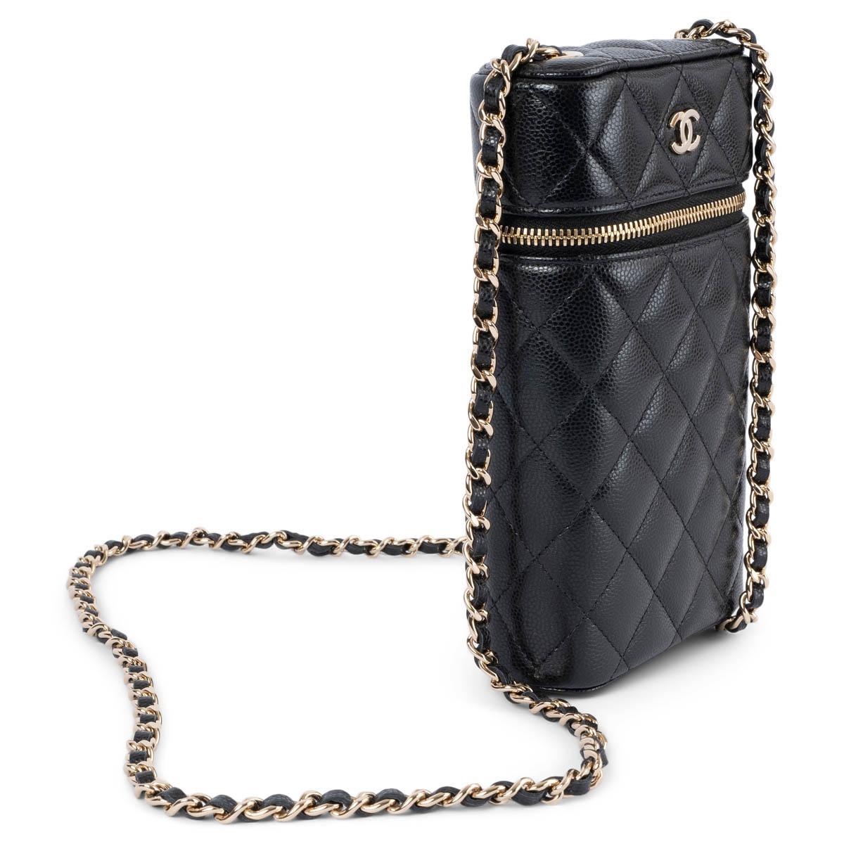 100% authentic Chanel 2022 Vanity phone holder in black quilted caviar calfskin featuring light gold-tone hardware. Opens with a zipper and is lined in burgundy grosgrain. Has been carried once or twice and is in virtually new condition. Comes with