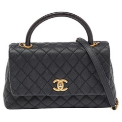 Chanel Schwarze kleine Coco Top Handle Bag aus gestepptem Kaviarleder und Eidechsengriff