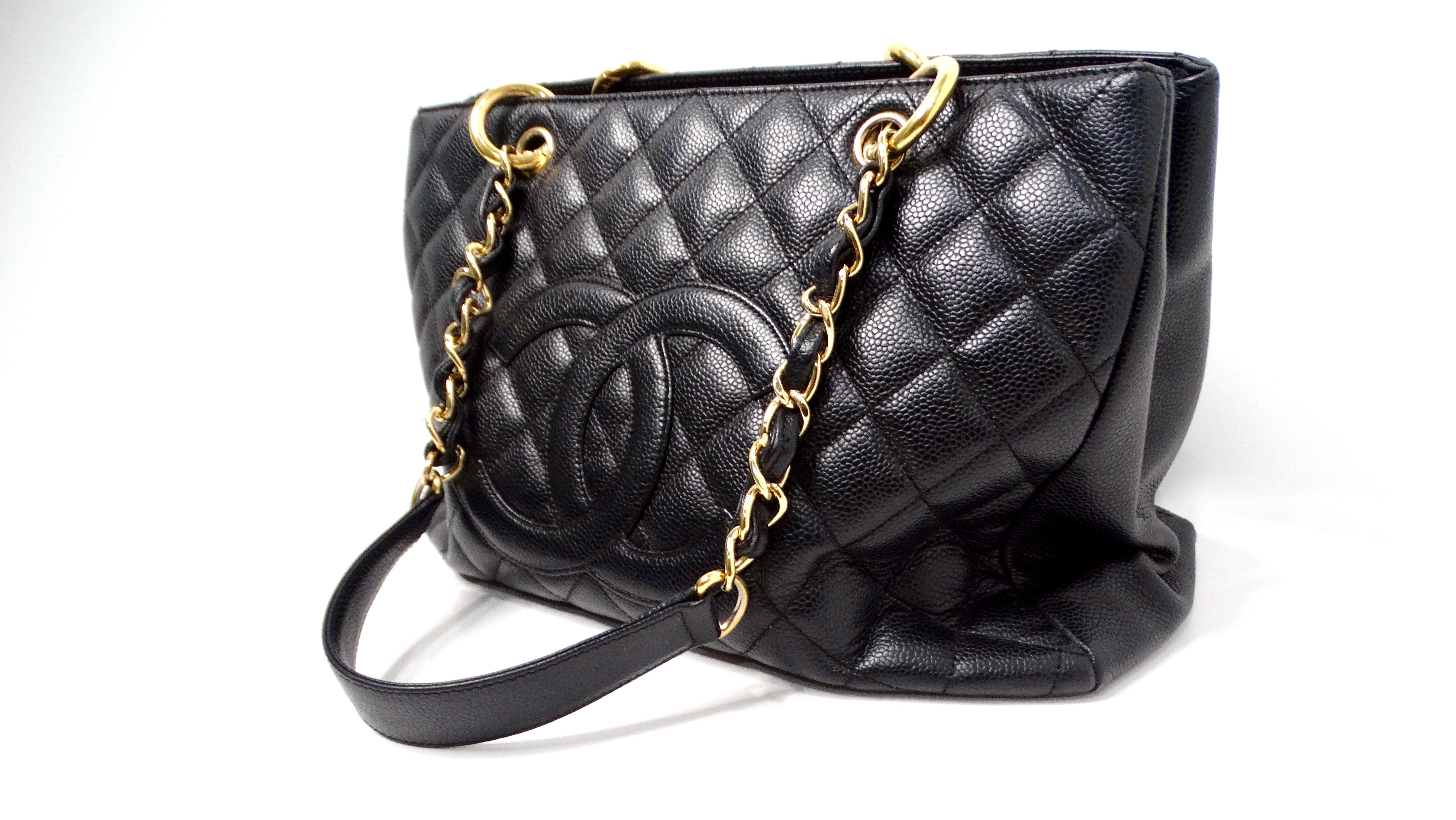 The 2006-08 Chanel Black Quilted Caviar Leather Grand Shopping Tote Bag is a timeless luxury accessory that embodies sophistication and versatility. Crafted from signature quilted caviar leather, this spacious tote features the iconic interlocking