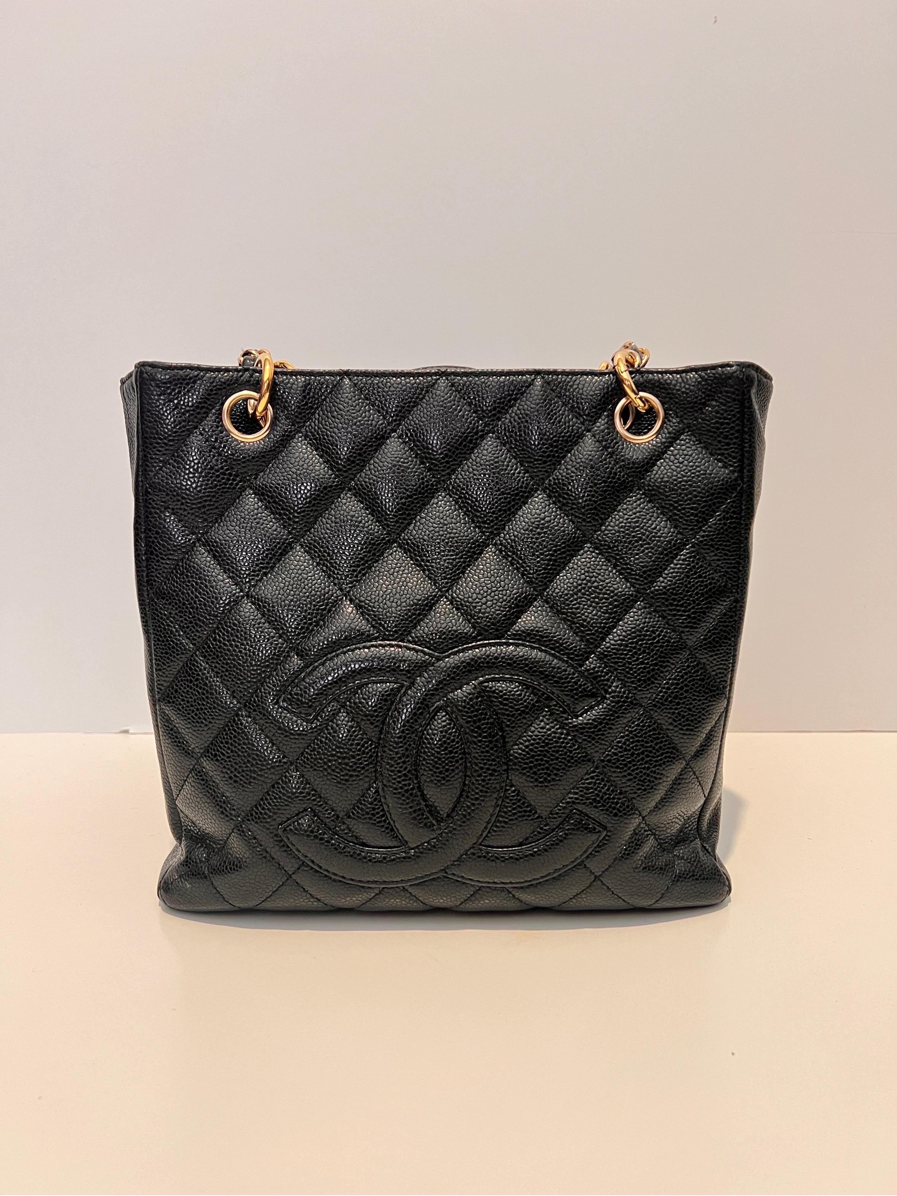 Chanel Black Quilted Caviar Leather Grand Shopping Tote.
Caviar Leather Handbag with iconic gold chain. Discontinued in 2015, the Grand Shopping tote bag is one CHANEL rarity that is highly treasured. This version was displays a classic design with