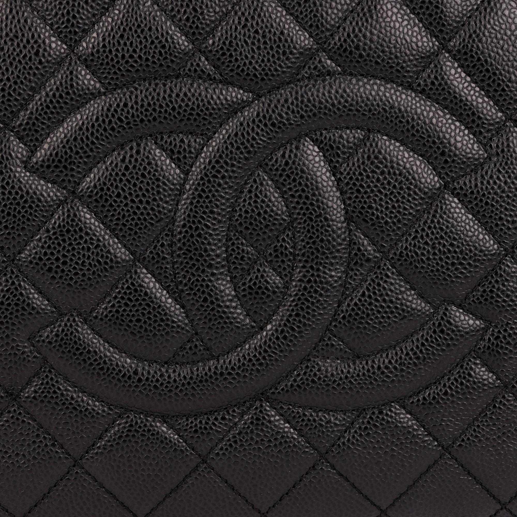 CHANEL
Black Quilted Caviar Leather Grand Shopping Tote GST

Xupes Reference: HB4018
Serial Number: 16687406
Age (Circa): 2012 
Accompanied By: Authenticity Card
Authenticity Details: Authenticity Card, Serial Sticker (Made in Italy)
Gender: