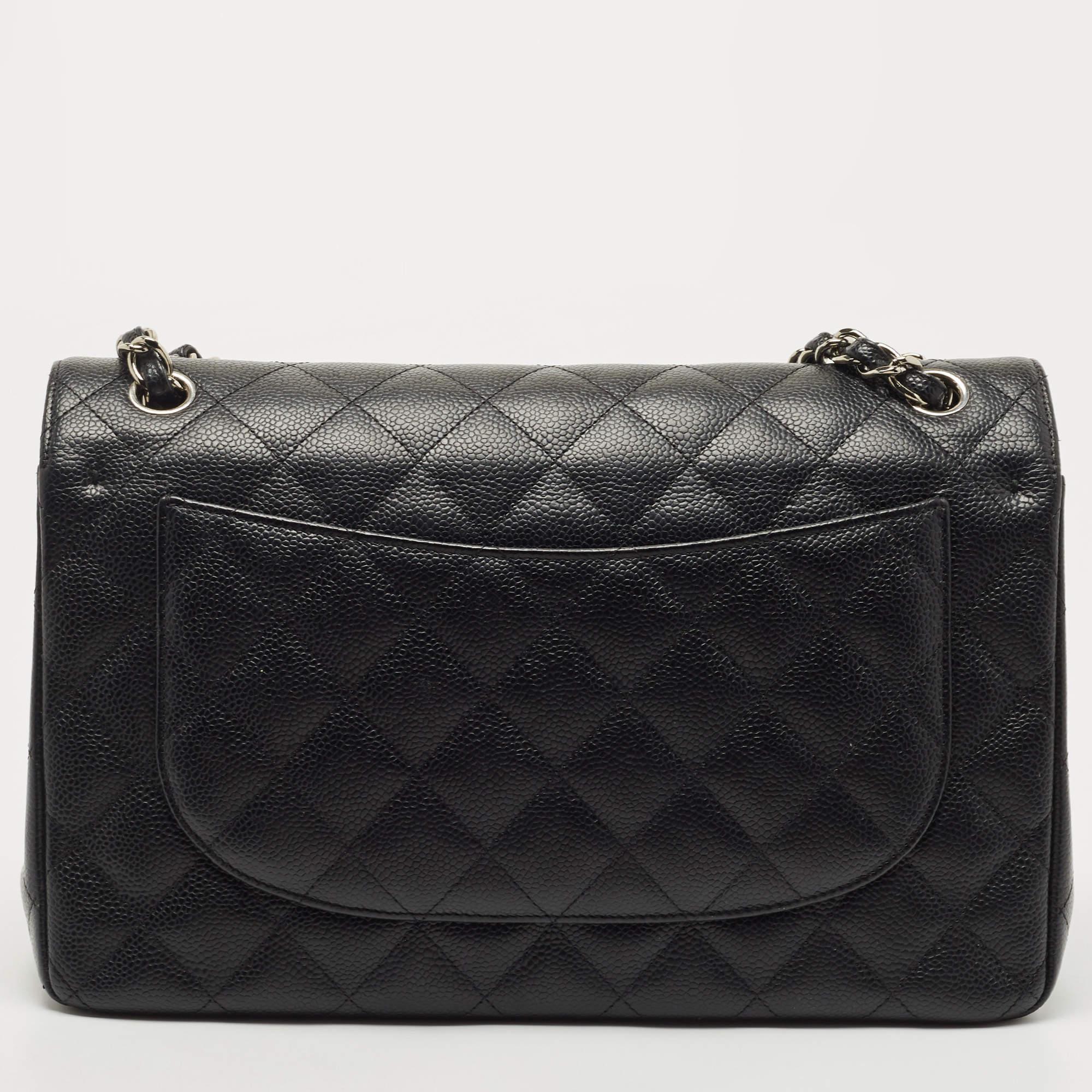Chanel's luxurious Classic Flap bag is a must-have in a well-curated wardrobe! This stunning bag has a masterfully-crafted leather exterior with silver-tone hardware and the iconic CC logo on the front. This Classic Double Flap is complete with a