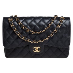 Chanel Schwarze gesteppte Jumbo Classic Double Flap Tasche aus Leder in Kaviar