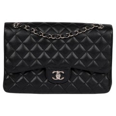 Chanel Schwarze gesteppte Jumbo Classic Double Flap Tasche aus Leder in Kaviar