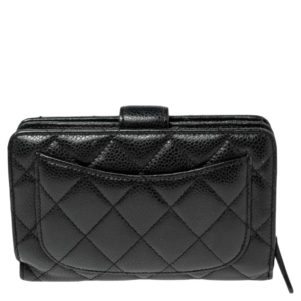 This L-Zip Pocket Wallet from Chanel has a beautiful all-over quilted pattern. Crafted from black Caviar leather it has a flap tab closure the has the CC logo. The wallet opens to multiple card slots and pockets for you to neatly organize your