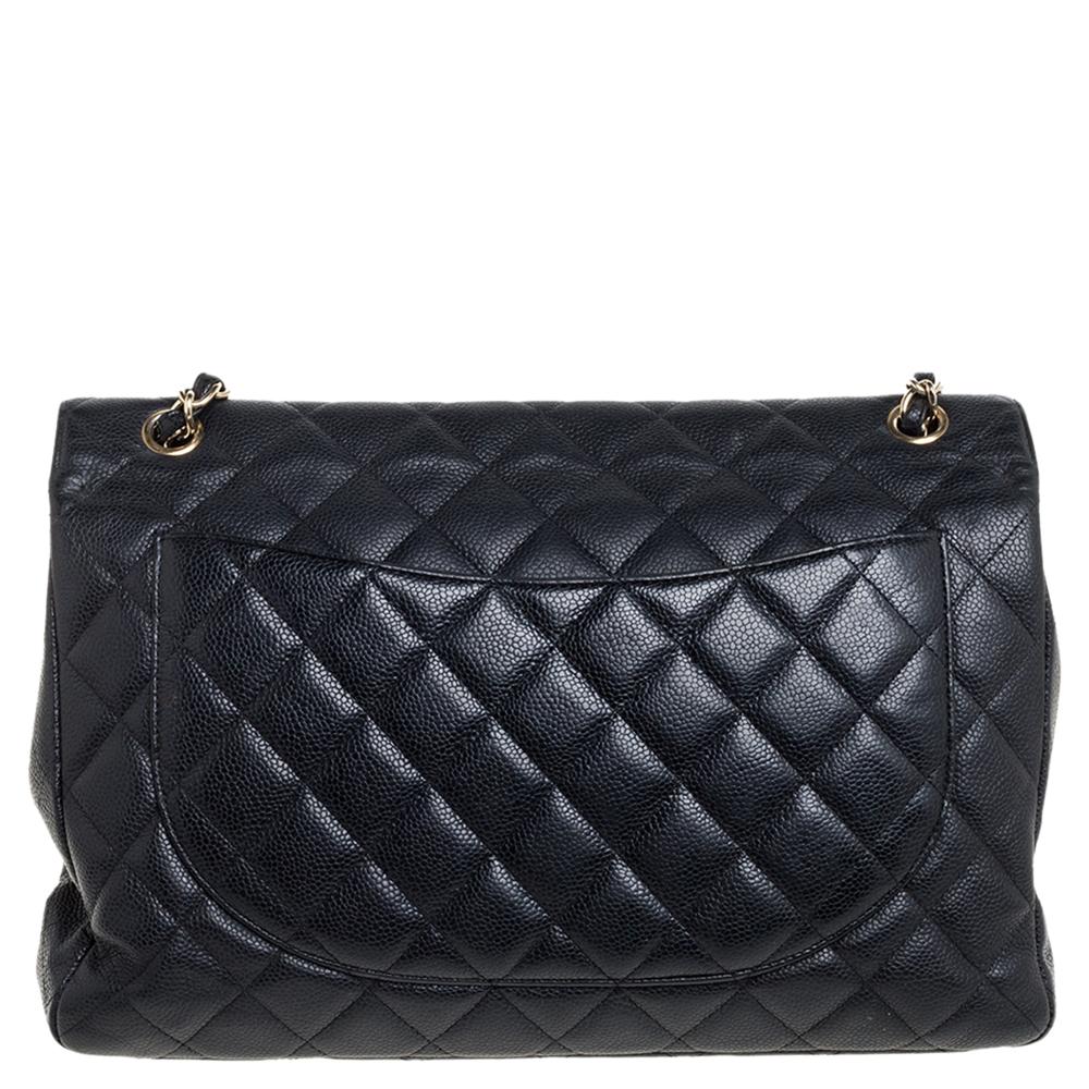 We are in utter awe of this Classic Double Flap bag from Chanel as it is appealing in a surreal way. Exquisitely crafted from caviar leather in a quilt design, it has a leather interior and the iconic CC turn-lock on the flap. The piece has