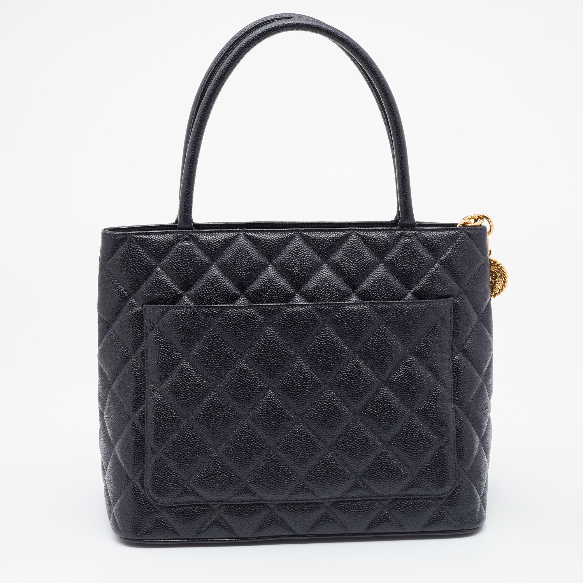 This Chanel tote is a favorite among fashionistas! Featuring the signature quilt and the 'CC' logo on the Caviar leather exterior, this black-colored tote has a luxe look. Equipped with two handles and a spacious interior for all your essentials, it