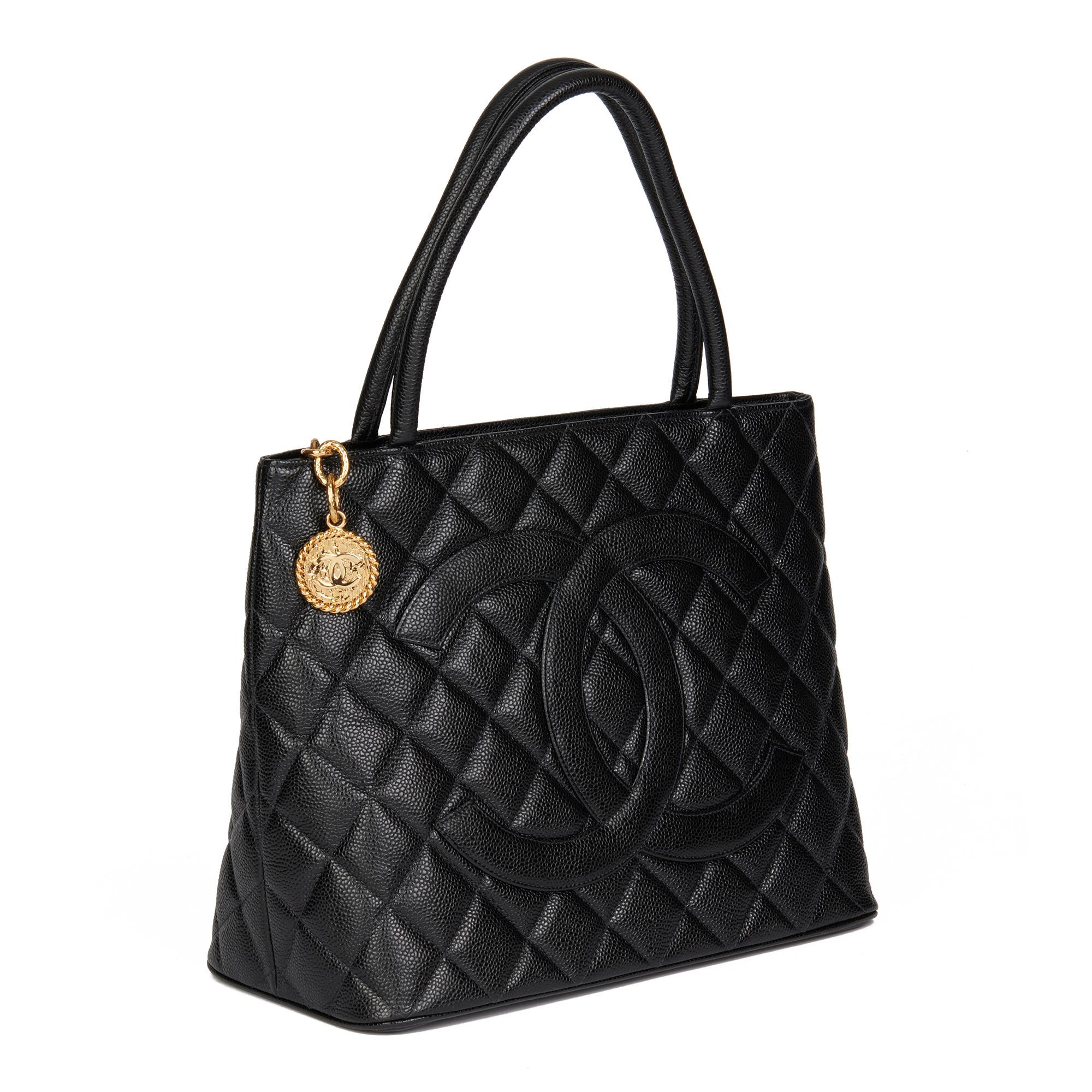 CHANEL
Black Quilted Caviar Leather Medallion Tote

Xupes Reference: HB4652
Serial Number: 7698952
Age (Circa): 2001
Accompanied By: Authenticity Card
Authenticity Details: Authenticity Card, Serial Sticker (Made in France)
Gender: Ladies
Type: