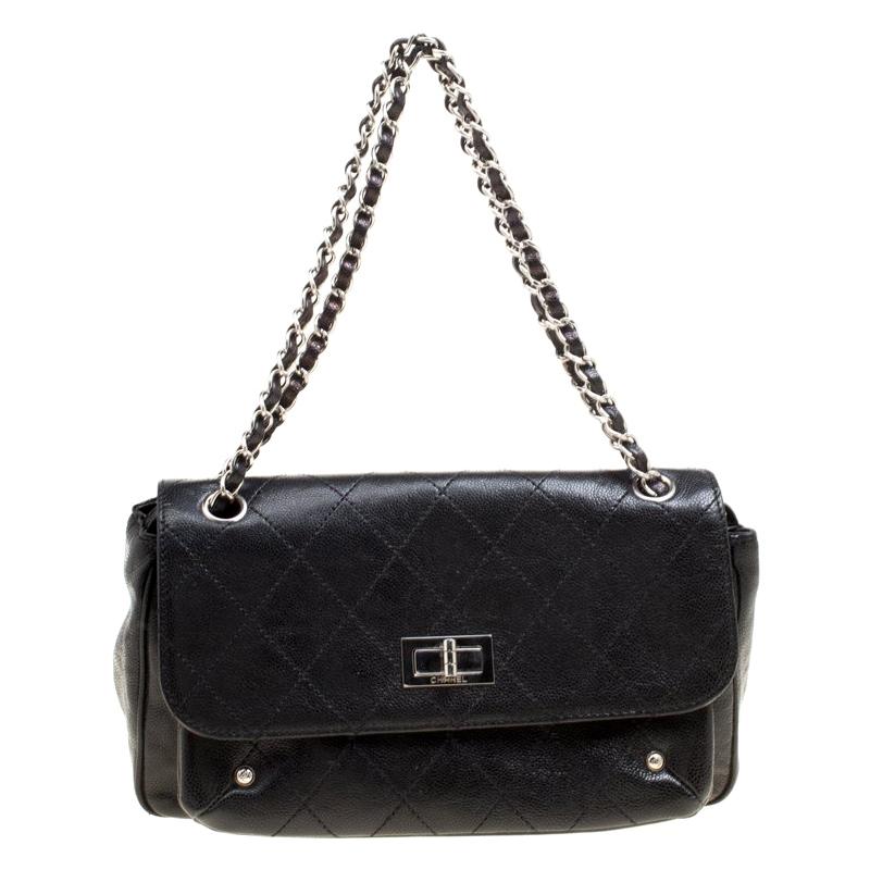 Charm your way through every gathering by swinging this Reissue shoulder bag from Chanel. Crafted from leather, the bag has a black exterior that features the signature quilted pattern. It comes with a flap that has a turn-lock and it reveals a