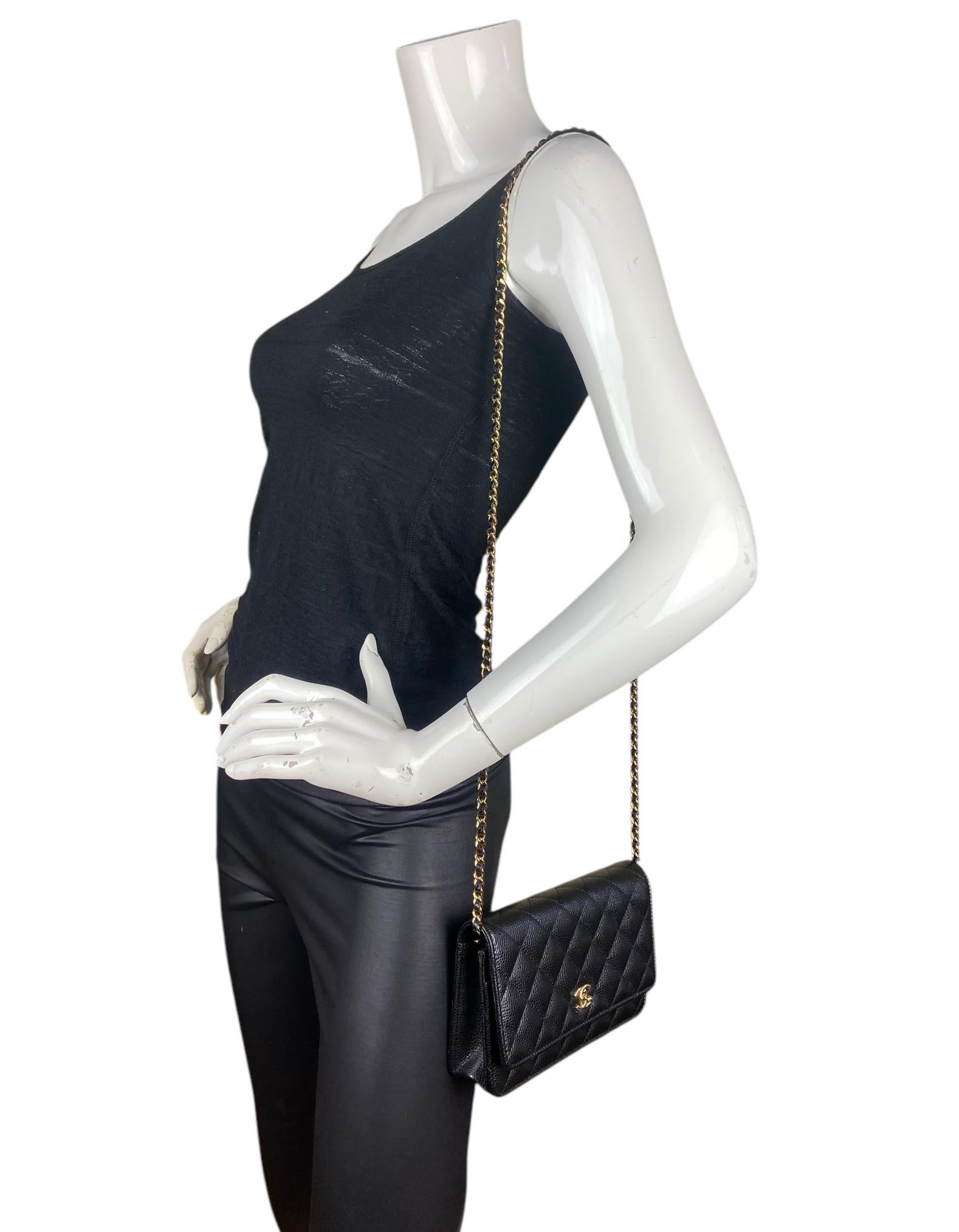 Chanel Black Quilted Caviar Leather Twistlock CC Wallet On Chain WOC Crossbody Bag. Chain can be tucked inside bag to also be worn as a clutch. 

Made in: Italy
Color: Black
Hardware: Goldtone
Materials: Caviar leather
Lining: Leather and