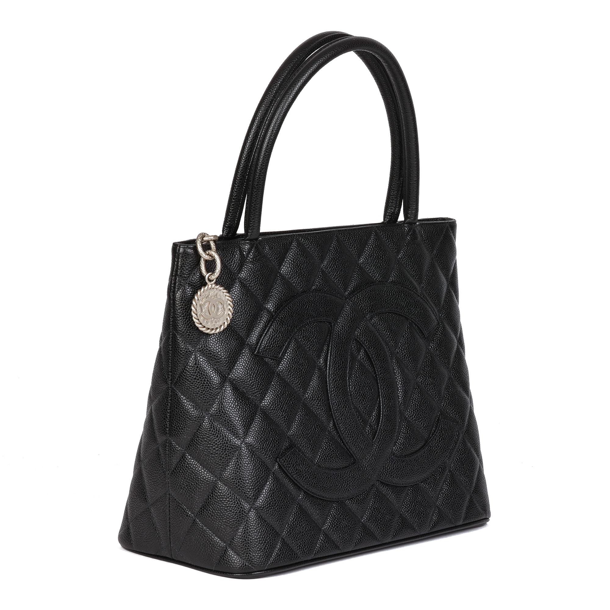 CHANEL
Black Quilted Caviar Leather Vintage Medallion Tote

Xupes Reference: HB4549
Serial Number: 7925508
Age (Circa): 2002
Accompanied By: Chanel Dust Bag, Authenticity Card, Care Booklet
Authenticity Details: Authenticity Card, Serial Sticker
