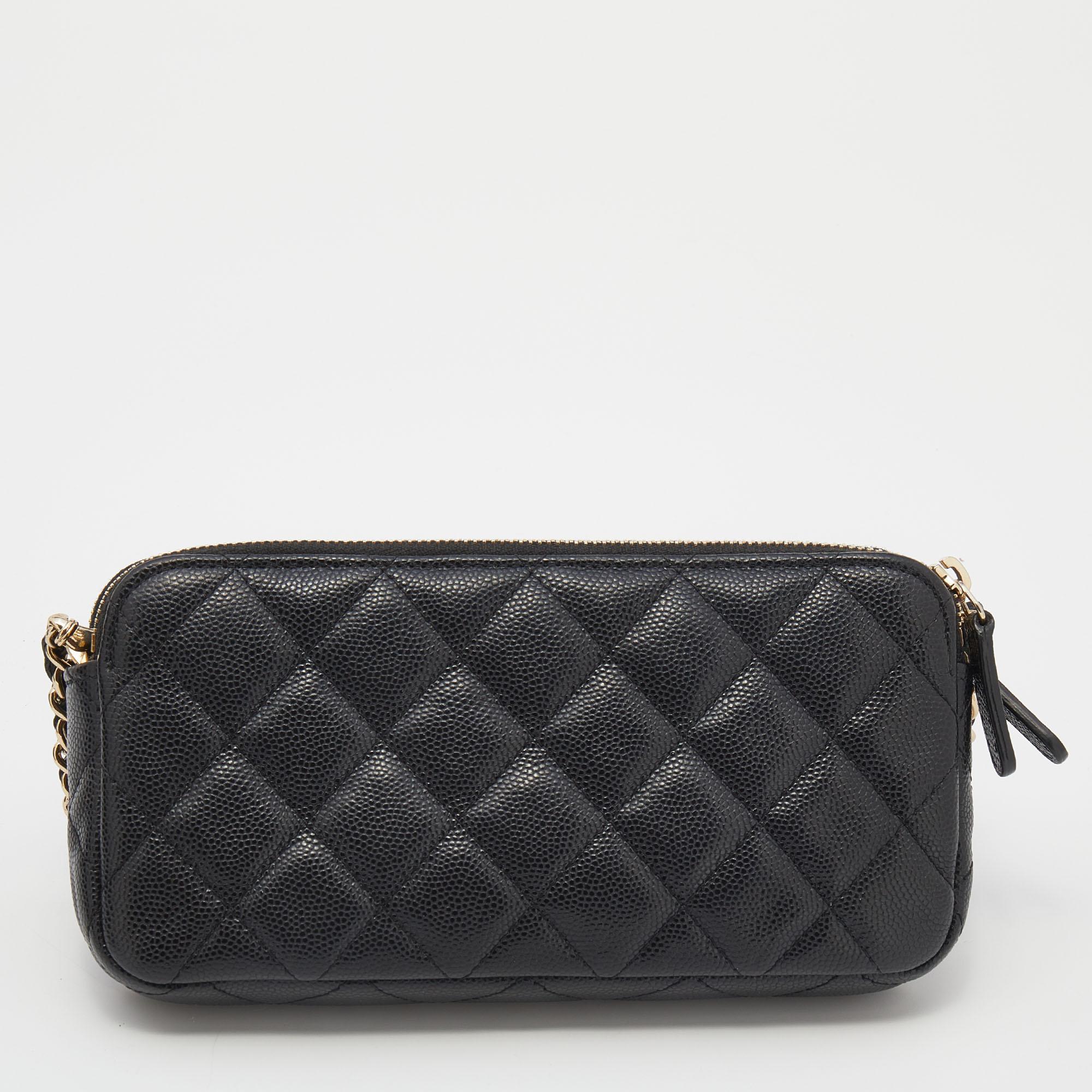 Crafted from black quilted Caviar leather, this wallet on chain by Chanel is something you will carry everywhere. It features a double zip closure, a signature interwoven chain strap, and gold-tone hardware. The interior is lined smoothly and