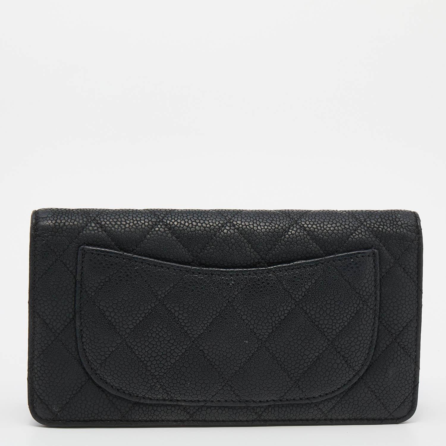 This Yen wallet from Chanel is a wonderful creation! It has been designed using black quilted leather, with a dainty silver-toned CC accent placed on the front. This continental-style wallet unveils a leather-fabric interior, perfectly organized to