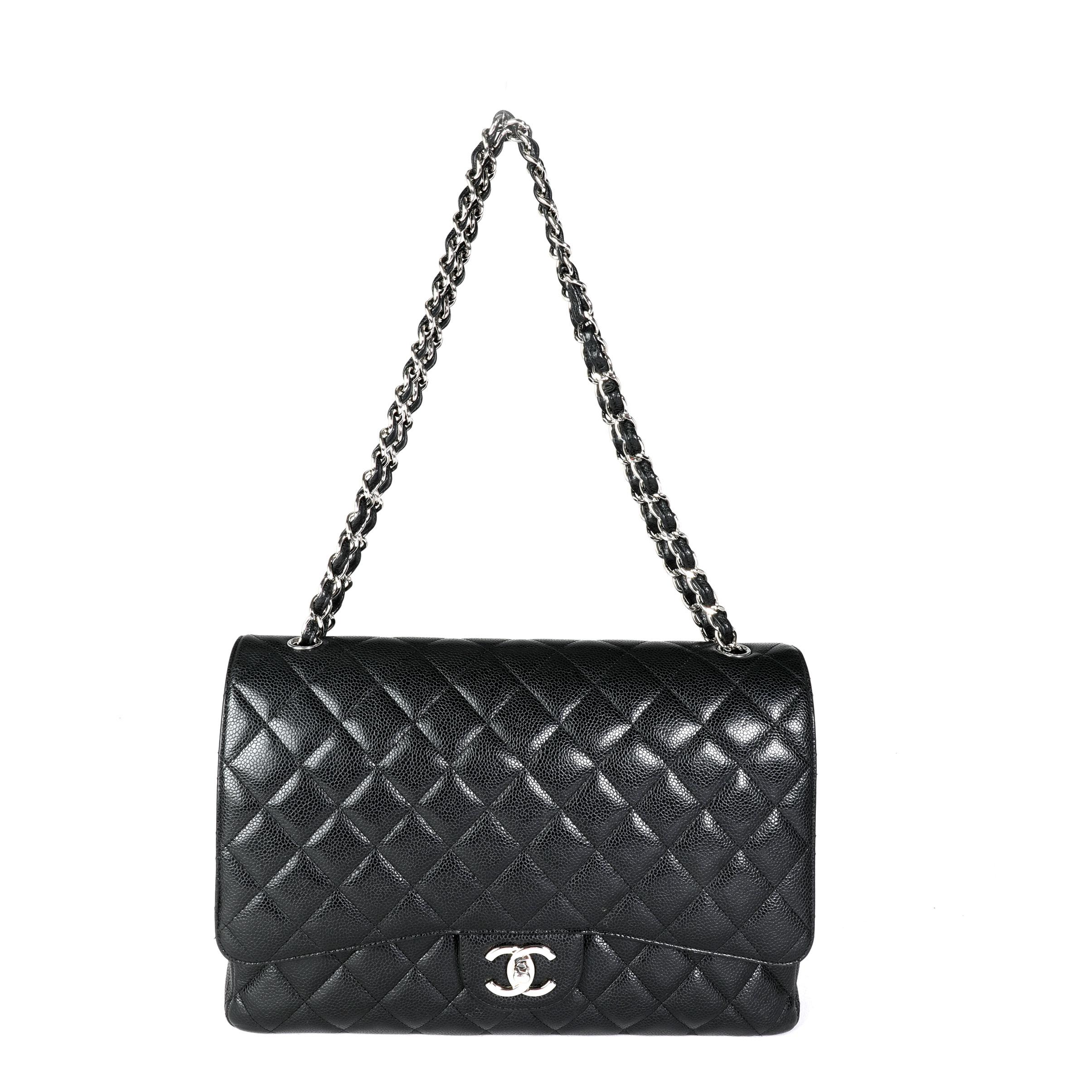 Listing Title: Chanel Black Quilted Caviar Maxi Classic Double Flap Bag
SKU: 116398
MSRP: 10000.00

Handbag Condition: Very Good
Condition Comments: Very Good Condition. Scuffing to corners. Marks to exterior. Scratching and tarnishing to hardware.