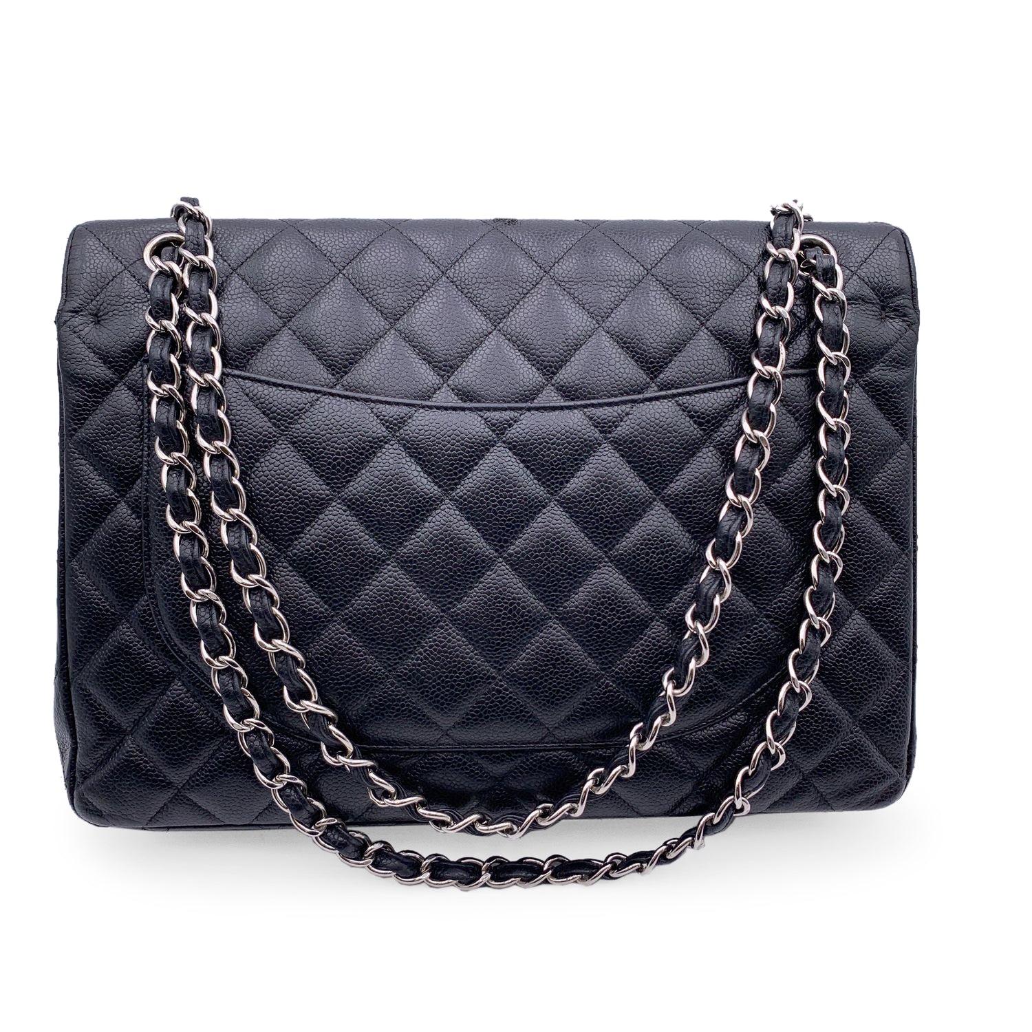 This beautiful Bag will come with a Certificate of Authenticity provided by Entrupy. The certificate will be provided at no further cost Chanel 'Maxi' Timeless Classic Quilted Double Flap Maxi Timeless 2.55 Bag. Black quilted caviar leather. Silver