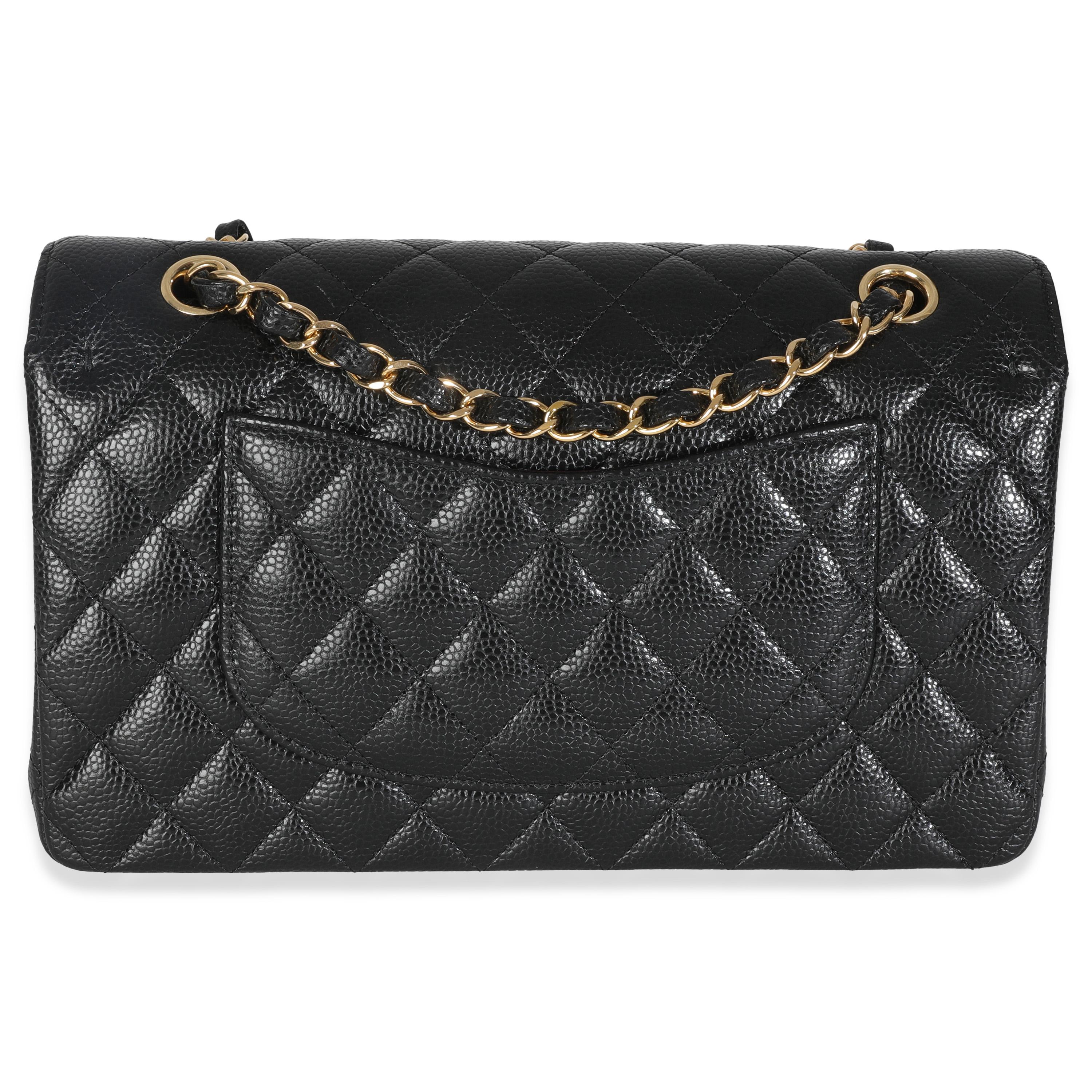 Listing Title: Chanel Black Quilted Caviar Medium Classic Double Flap Bag
SKU: 146872
MSRP: 10800.00 USD
Condition: Pre-owned 
Condition Description: A timeless classic that never goes out of style, the flap bag from Chanel dates back to 1955 and