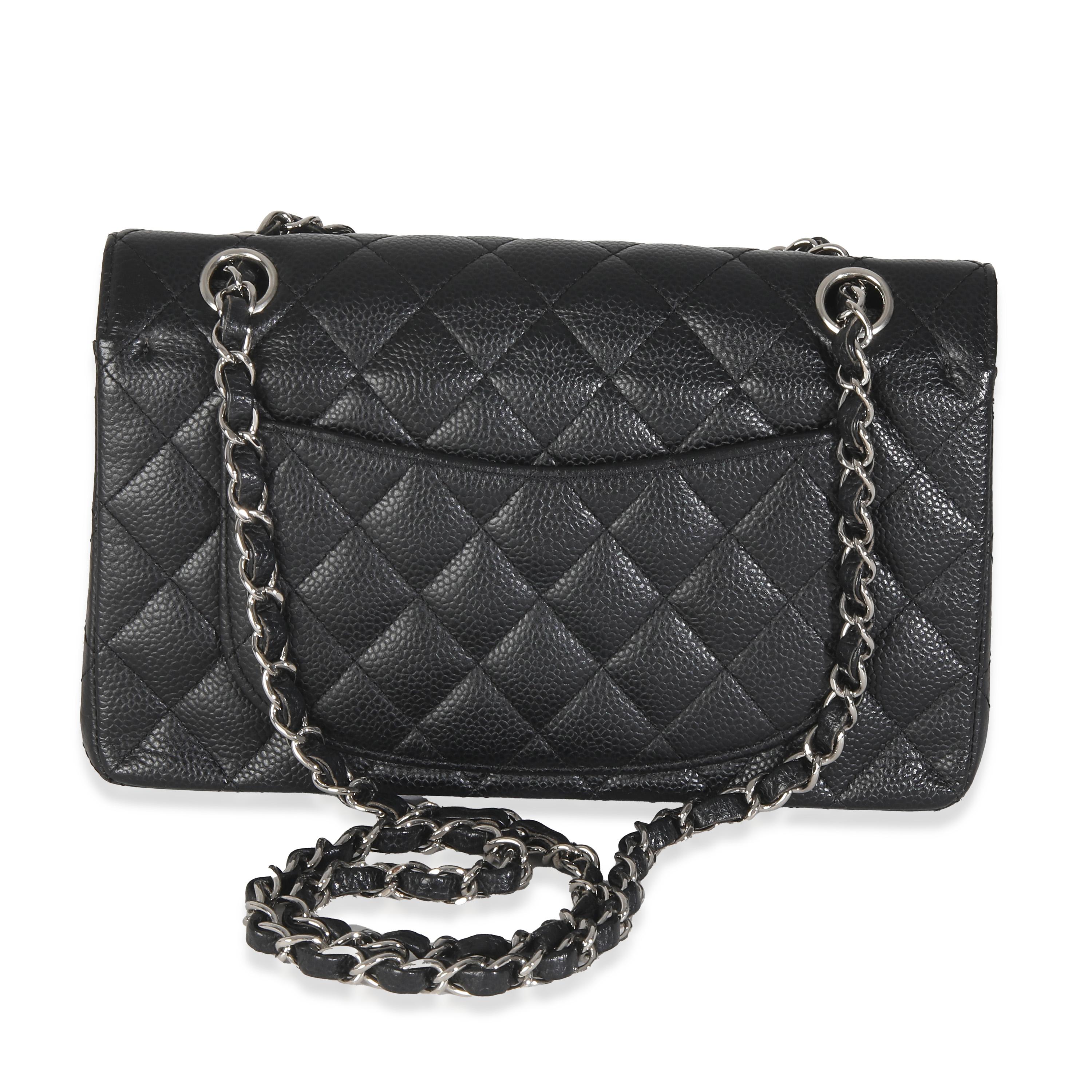 Listing Title: Chanel Black Caviar Small Double Flap
SKU: Z146276
Condition: Pre-owned 
Condition Description: A timeless classic that never goes out of style, the flap bag from Chanel dates back to 1955 and has seen a number of updates. The design