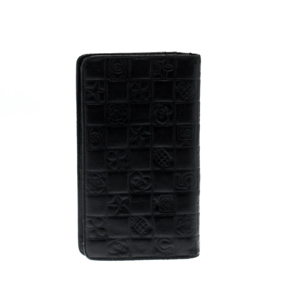 This wallet from Chanel brings along a touch of luxury and immense style. It is crafted from quilted leather carrying various signature motifs embossed on the exterior. It comes equipped with slip compartments and multiple slots just so you can