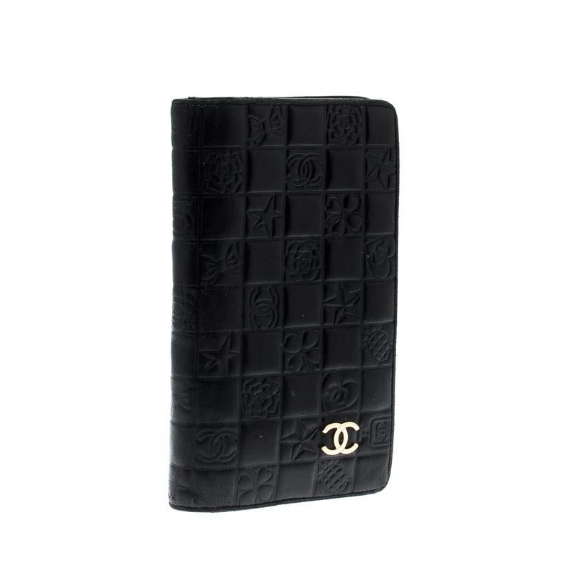 This wallet from Chanel brings along a touch of luxury and immense style. It is crafted from quilted leather carrying various signature motifs embossed on the exterior. It comes equipped with slip compartments and multiple slots just so you can