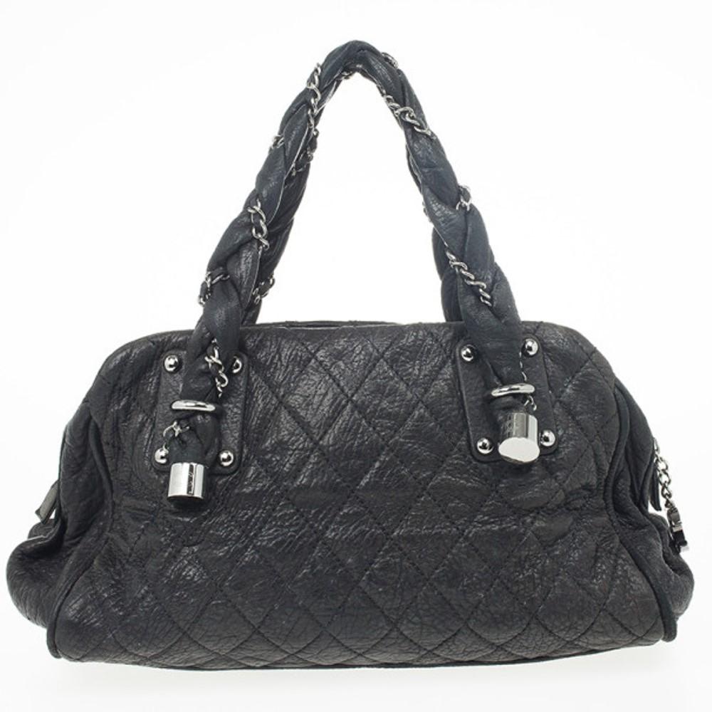 This beautiful Chanel Black Quilted Distressed Leather Lady Braid Bowler Bag is definitely for the fashionistas. From the 2007 collection, it's crafted from distressed lambskin leather. This Chanel tote bag features a quilted body, chain handles