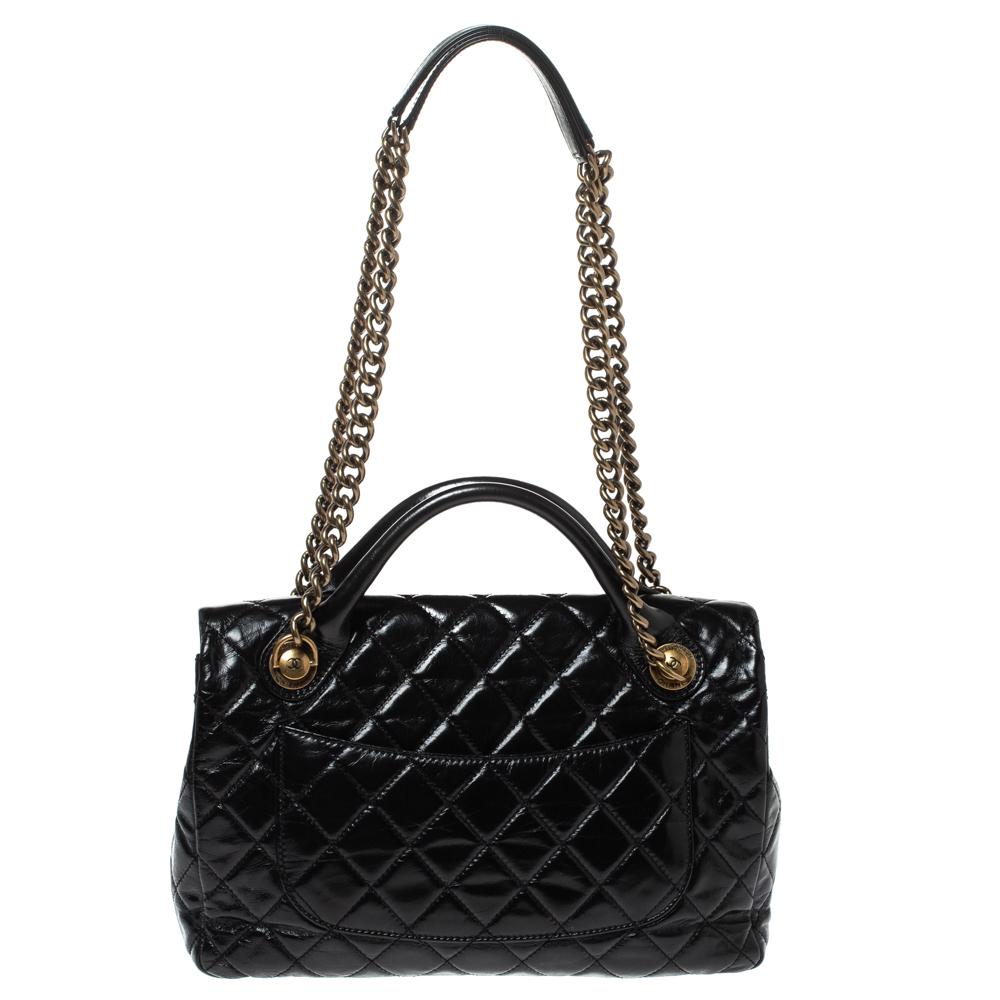 Chanel's bags are iconic and monumental in the history of fashion. Splurge on this gorgeous Castle Rock bag that is crafted from black glazed leather and features the signature quilted pattern all over. It has two top handles as well as two