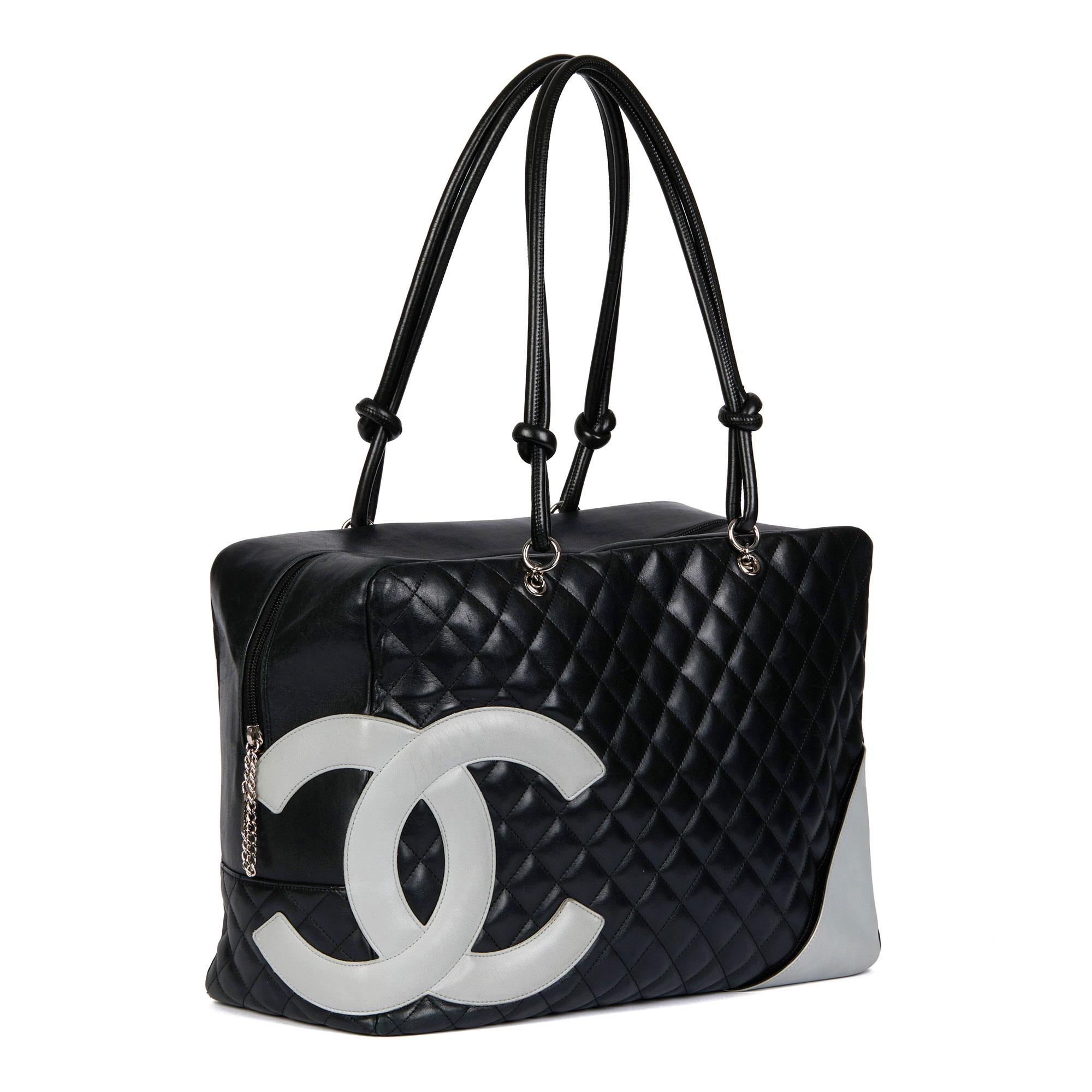 CHANEL
Black Quilted & Grey Smooth Calfskin Leather Vintage Large Cambon 

Xupes Reference: CB721
Serial Number: 9803162
Age (Circa): 2000
Authenticity Details: Serial Sticker (Made in Italy) 
Gender: Ladies
Type: Tote, Shoulder

Colour: