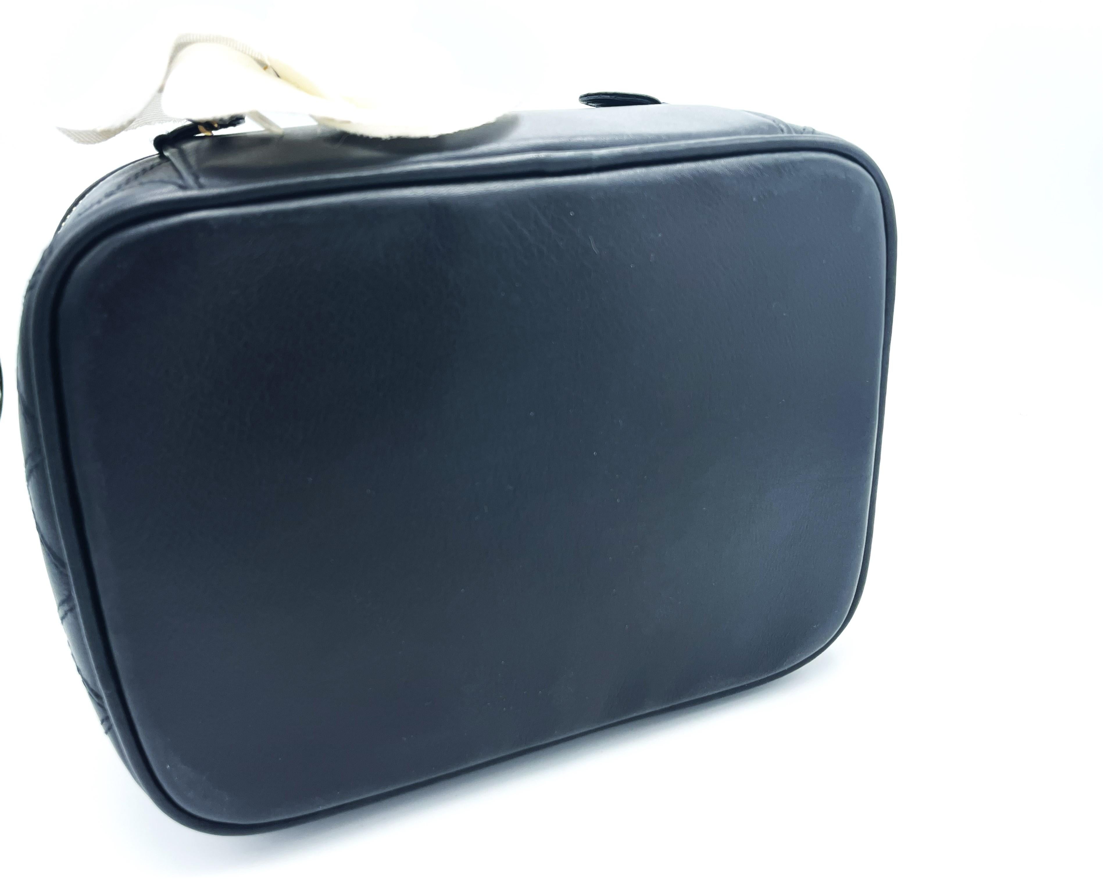 Women's or Men's CHANEL BLACK QUILTED LAMBSKIIN VANITY CASE, classic interlocking CC logo, 1990s For Sale