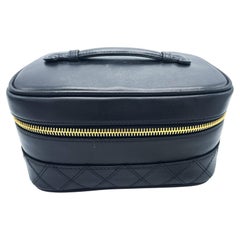 CHANEL BLACK QUILTED LAMBSKIIN VANITY CASE, classic interlocking CC logo, 1990s
