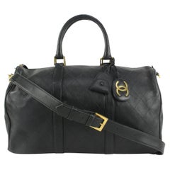 Chanel - Sac à main Boston en cuir d'agneau noir matelassé avec sangle 1110c8