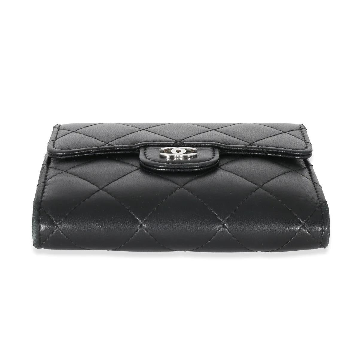 Dimensions: 4.5 X 4.0 X 0.5
Exterior Color: Black
Exterior Material: Quilted
Lambskin
Includes: Dust Bag 
Made In: Italy
Authentic
In very good condition 