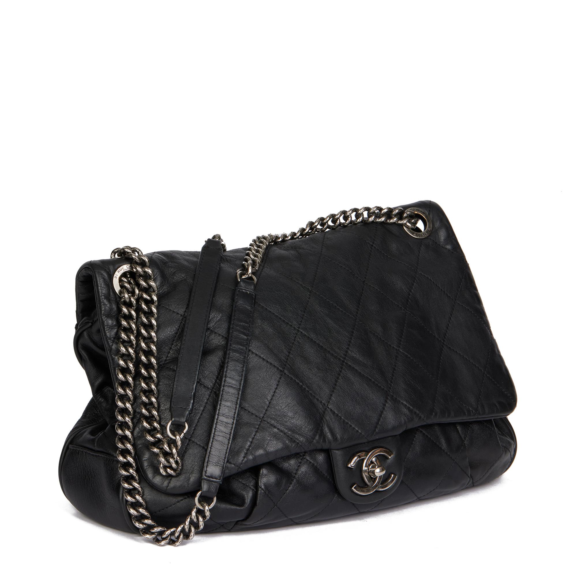CHANEL
Black Quilted Lambskin Coco Pleats Flap Bag

Xupes Reference: HB4506
Serial Number: 17071534
Age (Circa): 2012
Accompanied By: Chanel Dust Bag
Authenticity Details: Serial Sticker (Made in Italy)
Gender: Ladies
Type: Shoulder,