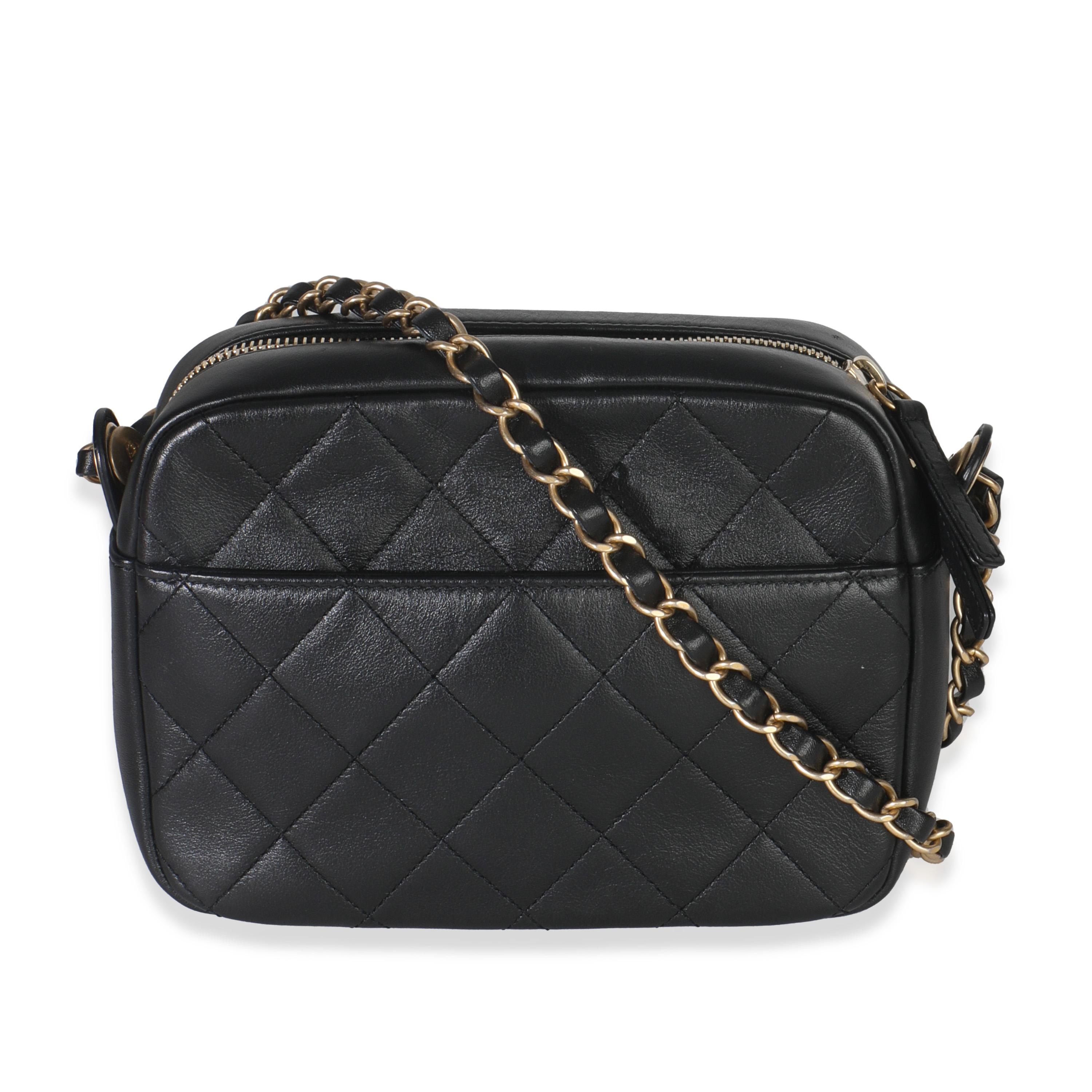 Listing Title: Chanel Black Quilted Lambskin Enchained Logo Chain Camera Case
SKU: Z149751
MSRP: 4100.00 USD
Condition: Pre-owned 
Handbag Condition: Excellent
Condition Comments: Item is in excellent condition and displays light signs of wear.  