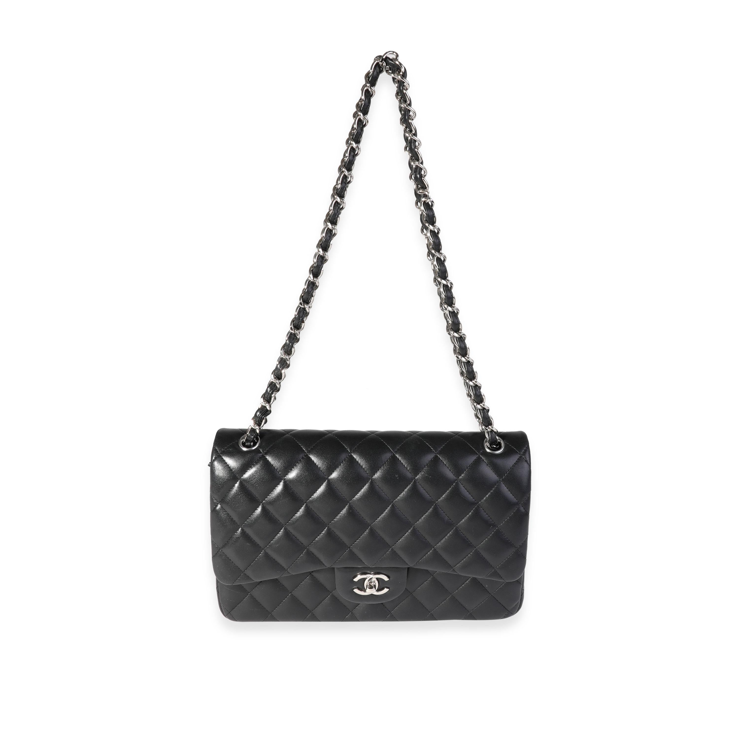 Listing Title: Chanel Black Quilted Lambskin Jumbo Classic Double Flap Bag
SKU: 121373
MSRP: 9500.00
Condition: Pre-owned 
Handbag Condition: Good
Condition Comments: Good Condition. Scuffing to corners and throughout exterior. Light scratching to