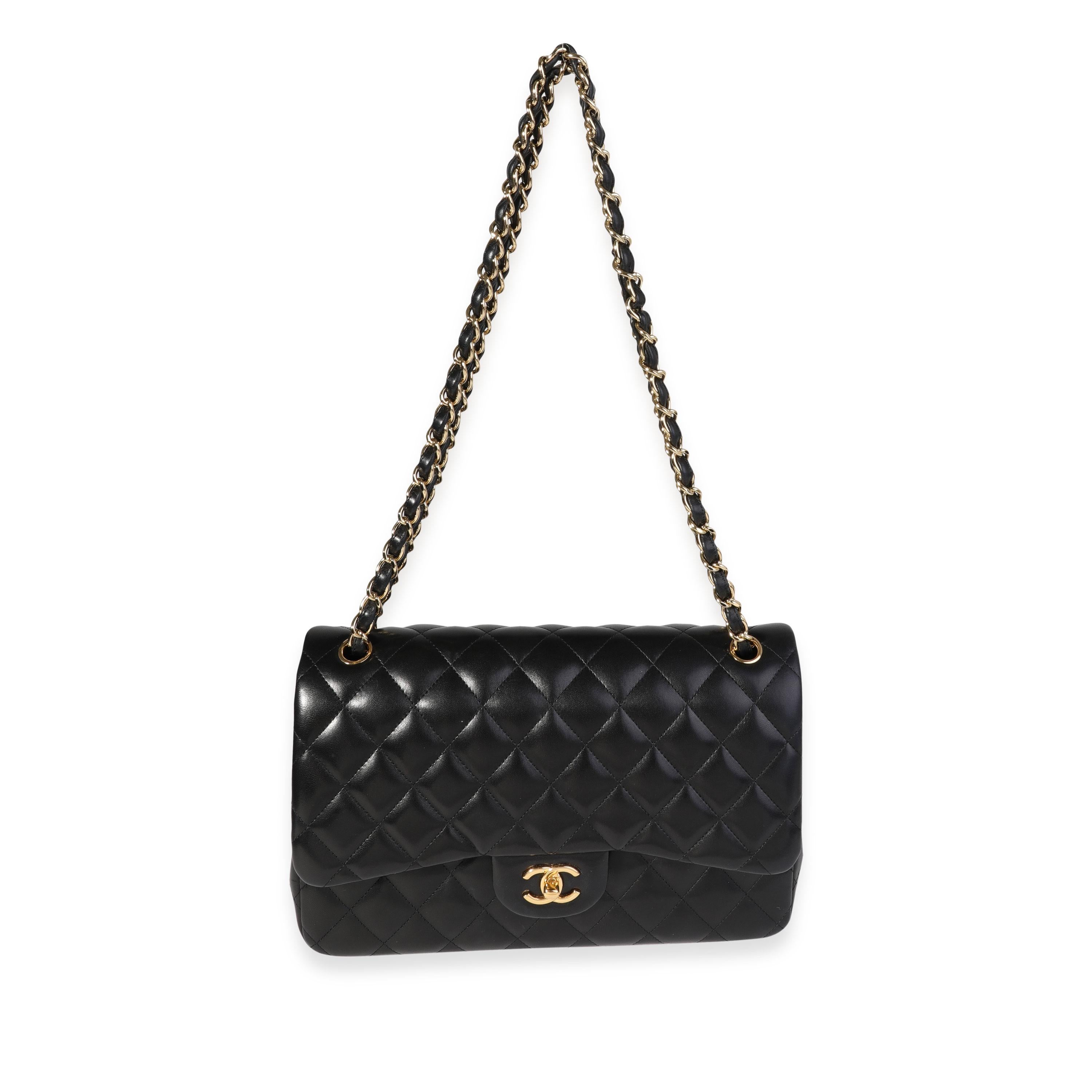 Listing Title: Chanel Black Quilted Lambskin Jumbo Classic Double Flap
SKU: 120359
MSRP: 9500.00
Condition: Pre-owned 
Handbag Condition: Very Good
Condition Comments: Very Good Condition. Scuffing to corners and throughout exterior. Discoloration