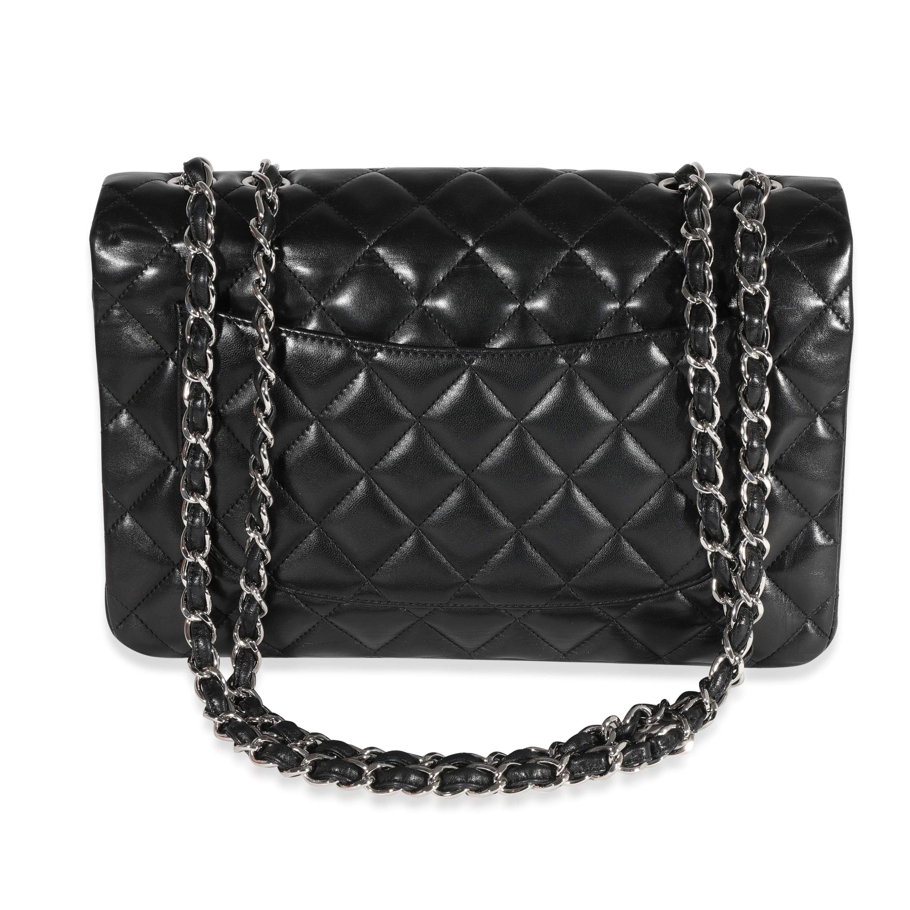 Listing Title: Chanel Black Quilted Lambskin Jumbo Classic Single Flap Bag
SKU: 122172
MSRP: 9500.00
Condition: Pre-owned 
Handbag Condition: Very Good
Condition Comments: Very Good Condition. Scuffing to corners and lightly to exterior. Scratching