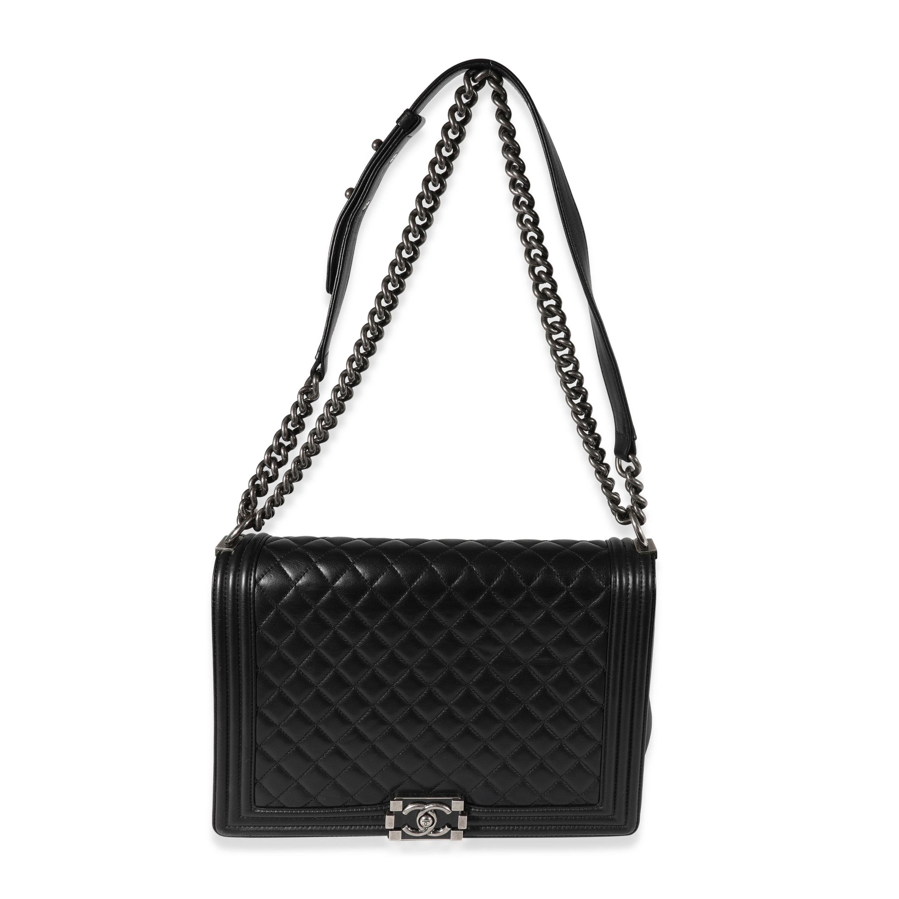 Listing Title: Chanel Black Quilted Lambskin Large Boy Bag
SKU: 121949
Condition: Pre-owned 
Handbag Condition: Good
Condition Comments: Good Condition. Scuffing to corners and exterior. Scuffing to interior leather. Discoloration and marks to