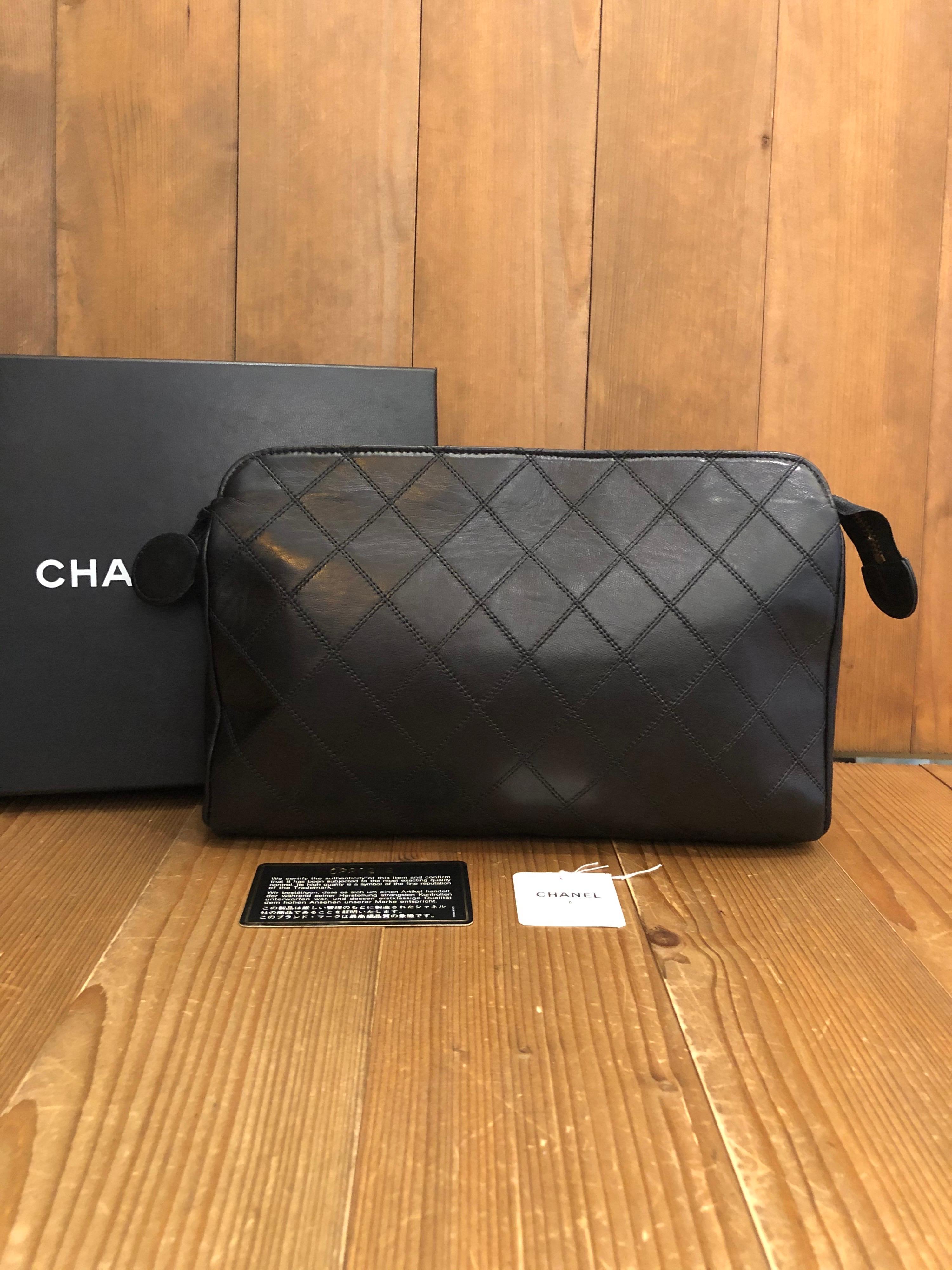 Authentic Chanel Clutch in black quilted Lambskin. Interior fully refurbished by Chanel store. Original tags preserved but serial sticker removed. Comes with original Chanel box.

Material: Lambskin leather 
Color: Black
Origin: France