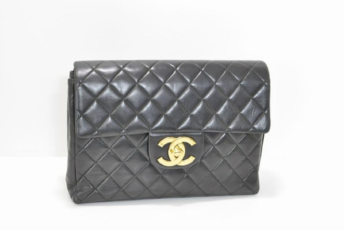 Chanel Deca backpack is crafted in black quilted Lambskin leather and square in shape, gold-tone hardware, interlocking CC logo at front flap, patch pocket at back, dual leather and chain shoulder straps, red leather lining with zipper closure at