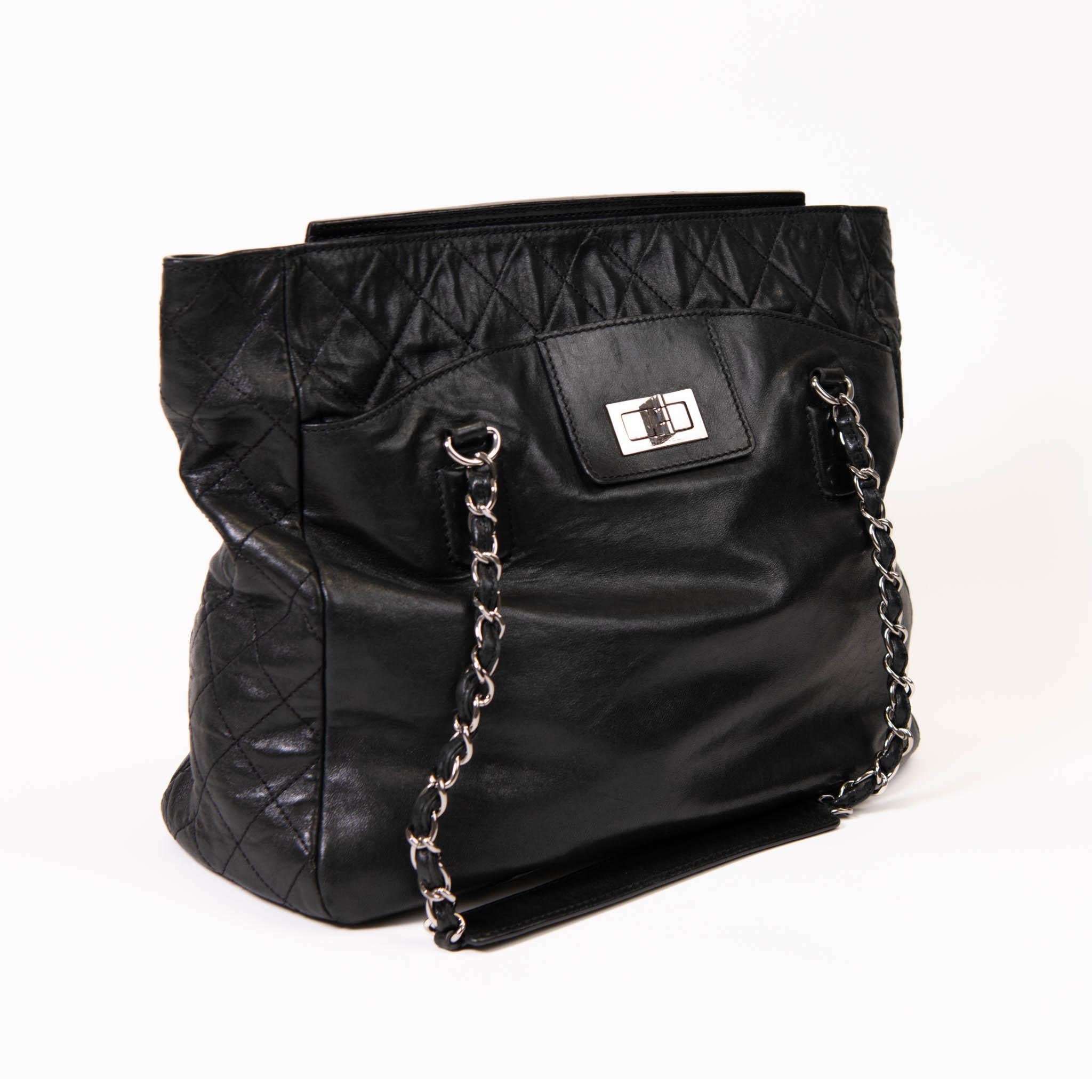 100% Authentic

Chanel Reissue East West Tote Quilted Lambskin Large is an elegant, classic bag that every fashionista needs in her wardrobe. Crafted from black diamond quilted lambskin over sized tote features four woven-in leather silver chain