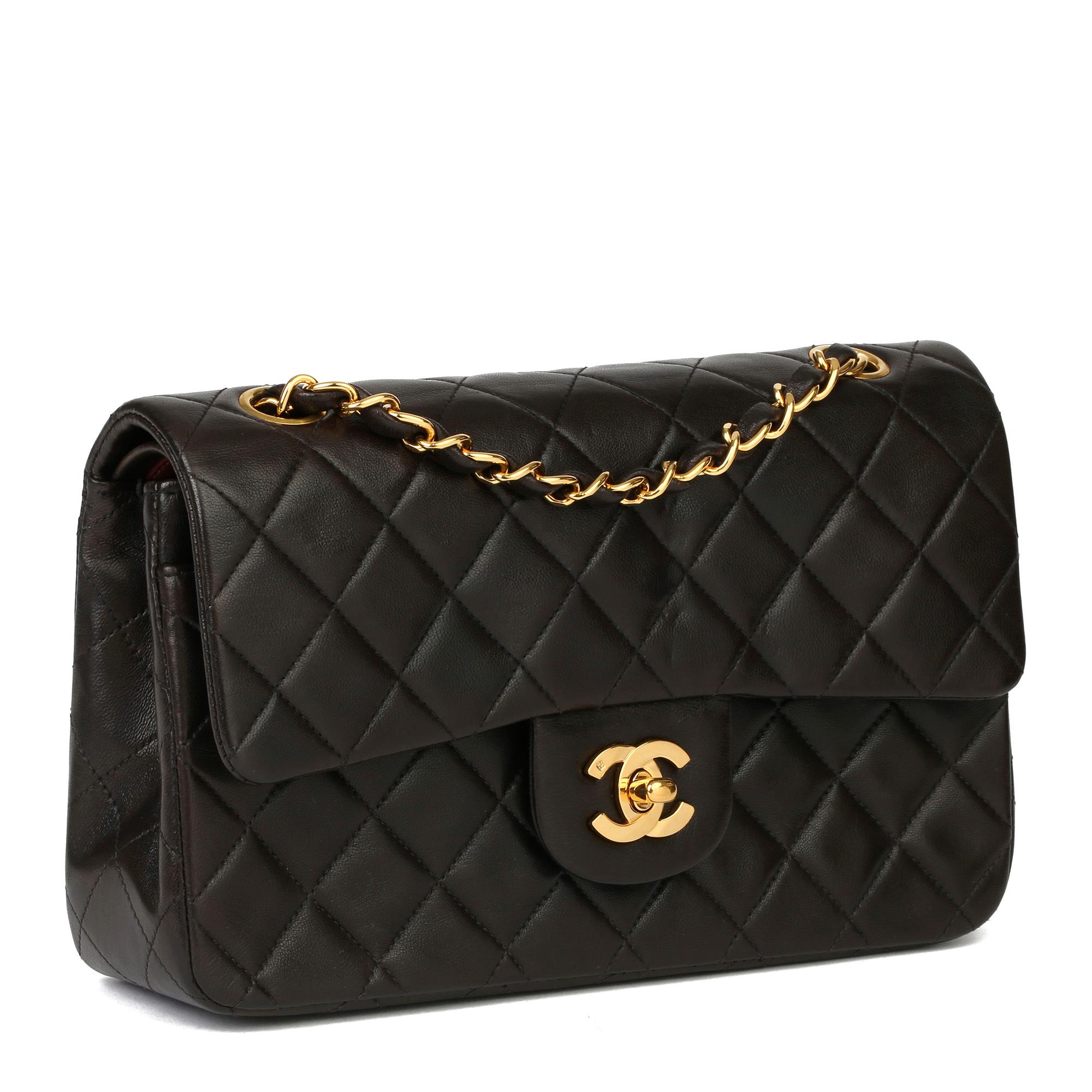 CHANEL
Black Quilted Lambskin Leather Vintage Small Classic Double Flap Bag

Xupes Reference: HB3927
Serial Number: 2604733
Age (Circa): 1994
Accompanied By: Chanel Dust Bag
Authenticity Details: Serial Sticker (Made in France)
Gender: Ladies
Type: