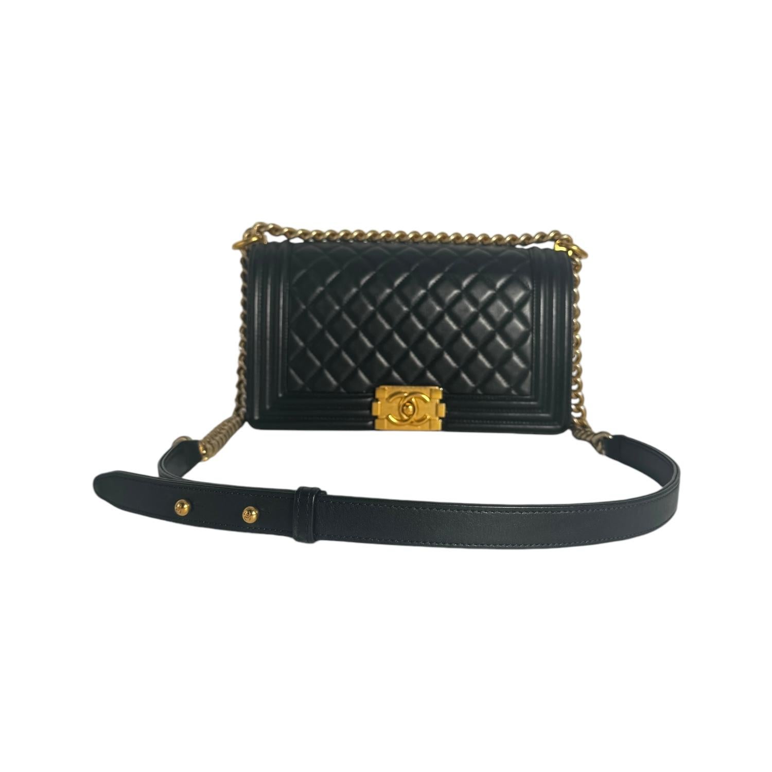 This chic shoulder bag is finely crafted of rich lambskin leather with signature diamond stitched quilting in black. The bag features a matte gold-tone shoulder strap with a leather shoulder pad and matte gold-tone facing Chanel Boy CC push lock.