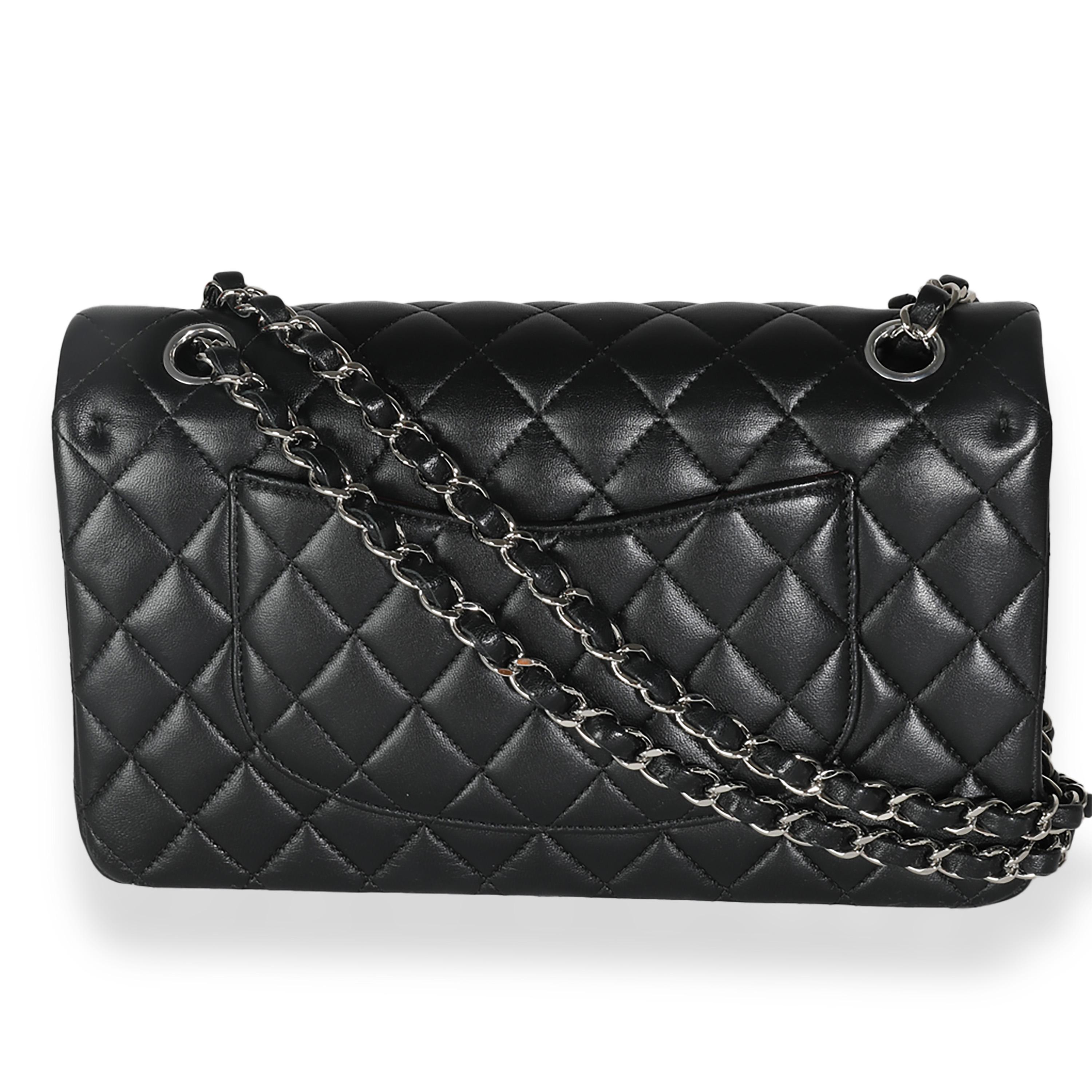 Listing Title: Chanel Black Quilted Lambskin Medium Classic Double Flap Bag
SKU: 140872
MSRP: 10800.00 USD
Condition: Pre-owned 
Condition Description: A timeless classic that never goes out of style, the flap bag from Chanel dates back to 1955 and