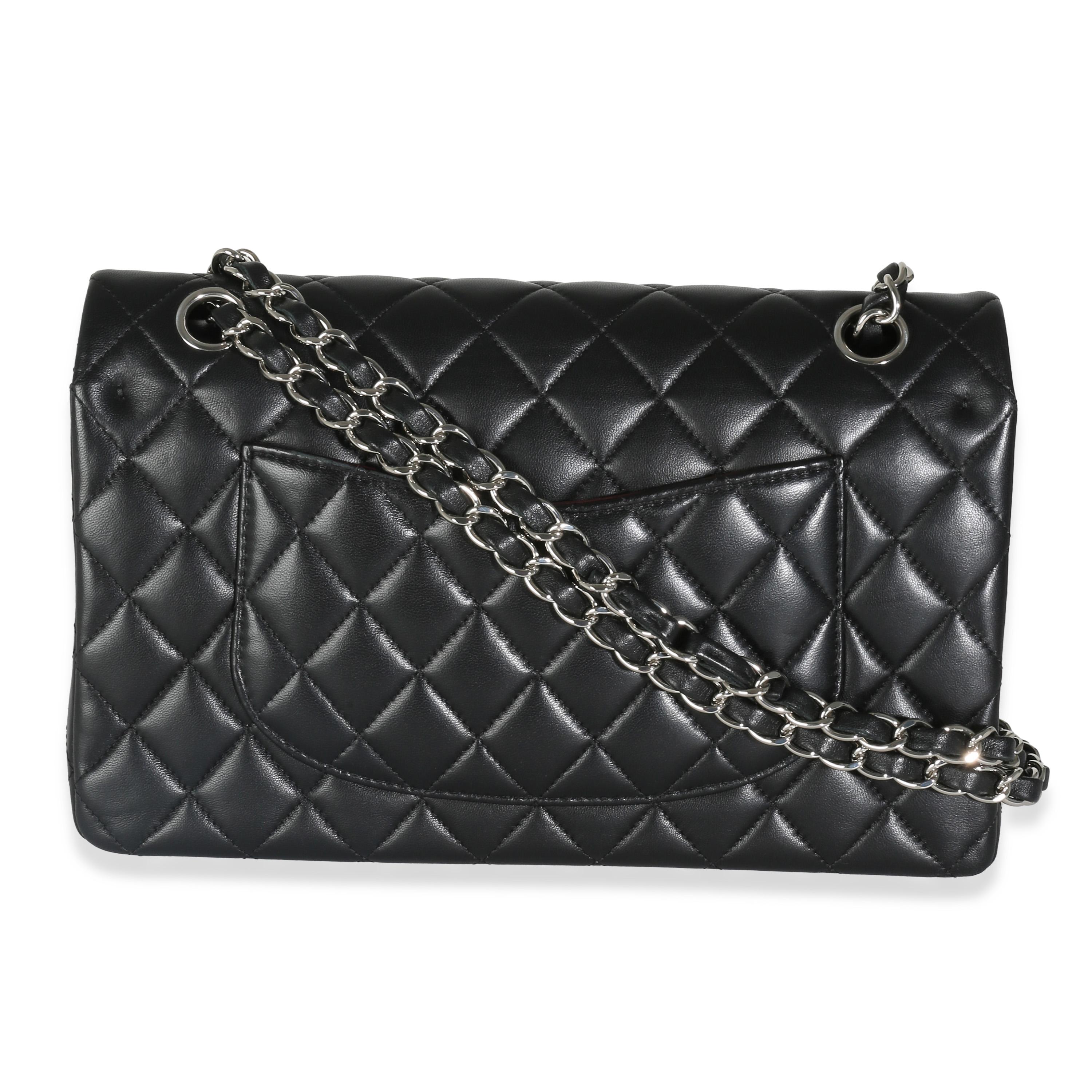 Listing Title: Chanel Black Quilted Lambskin Medium Classic Double Flap Bag
SKU: 142832
MSRP: 10800.00 USD
Condition: Pre-owned 
Condition Description: A timeless classic that never goes out of style, the flap bag from Chanel dates back to 1955 and