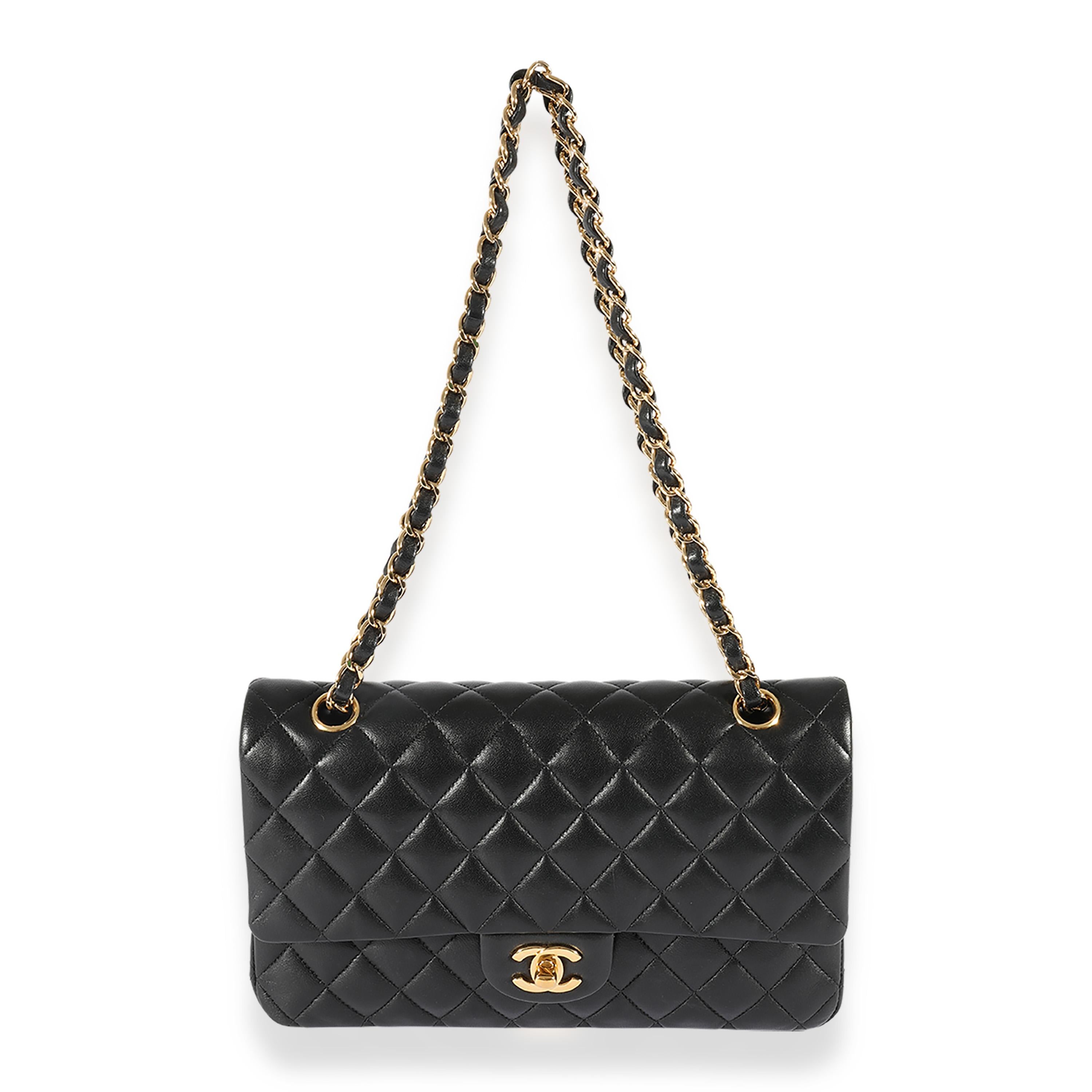 Listing Title: Chanel Black Quilted Lambskin Medium Classic Double Flap Bag
SKU: 124847
Condition: Pre-owned 
Handbag Condition: Very Good
Condition Comments: Very Good Condition. Scuffing to corners and exterior. Scratching to hardware. Scuffing